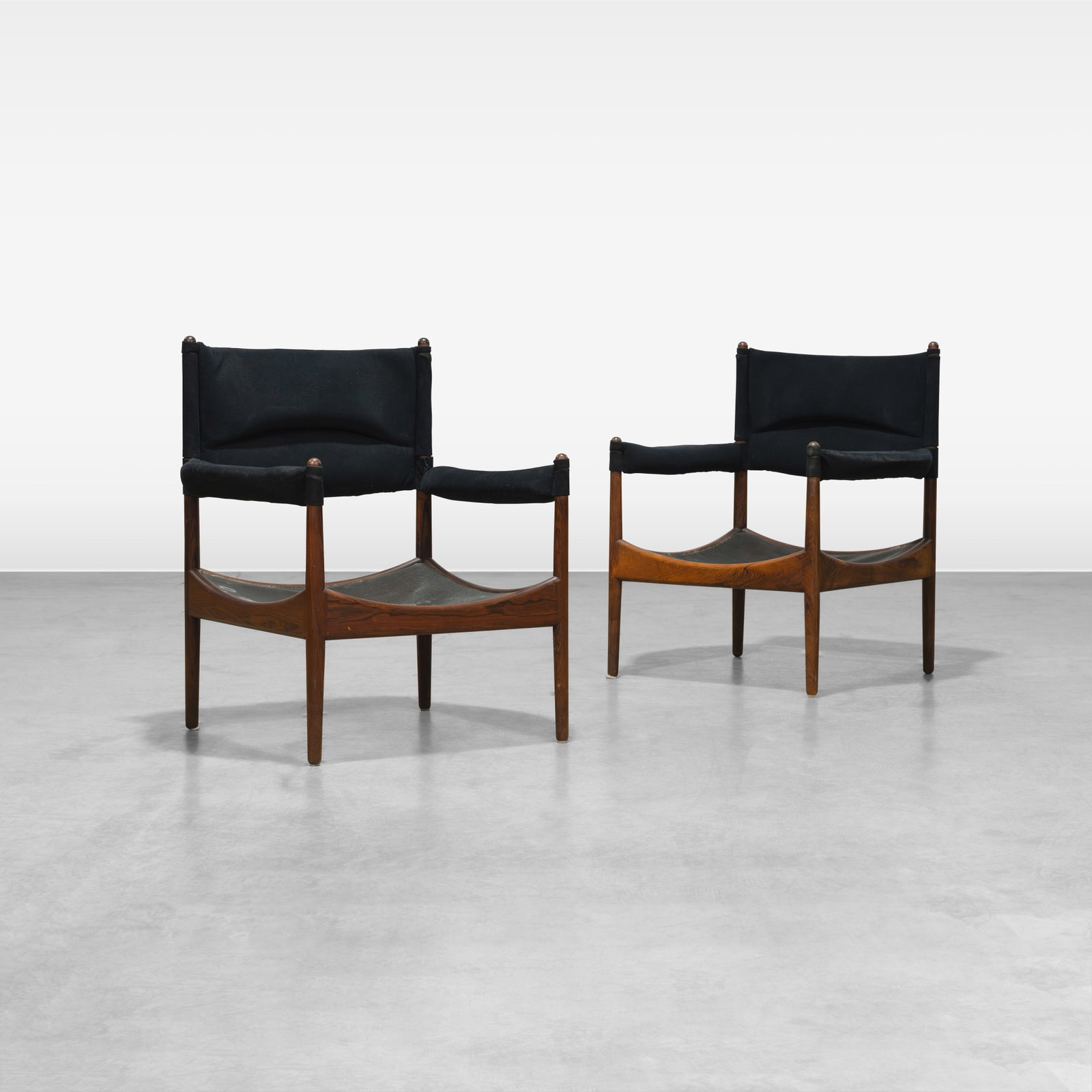 Kristian Vedel - Lounge Chairs: A pair of rosewood 'Modus' lounge chairs by Kristian Vedel. All measurements are in inches. Height x Width x Depth