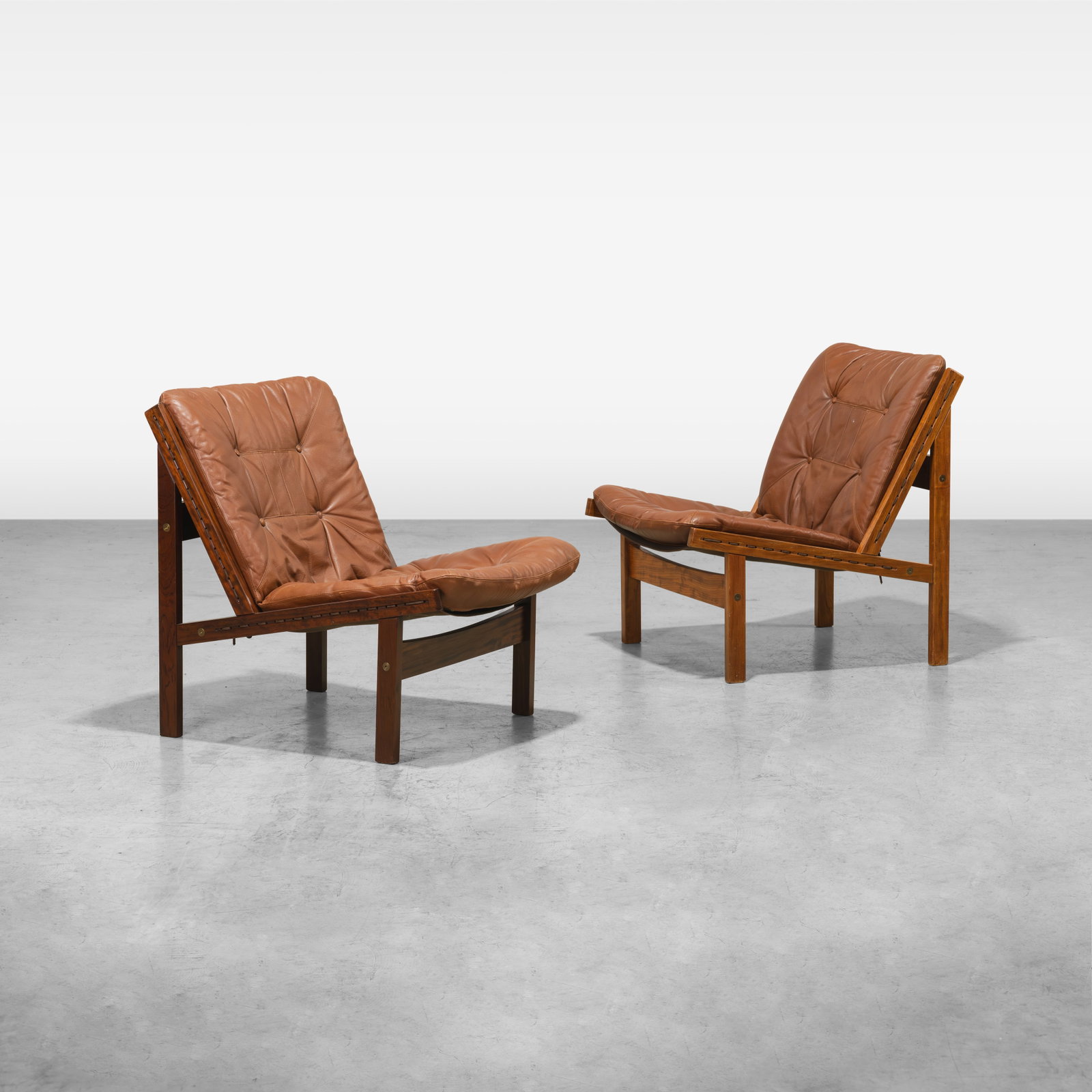 Torbjorn Afdal - Lounge Chairs: A pair of 'Hunter' lounge chairs by Torbjorn Afdal. All measurements are in inches. Height x Width x Depth