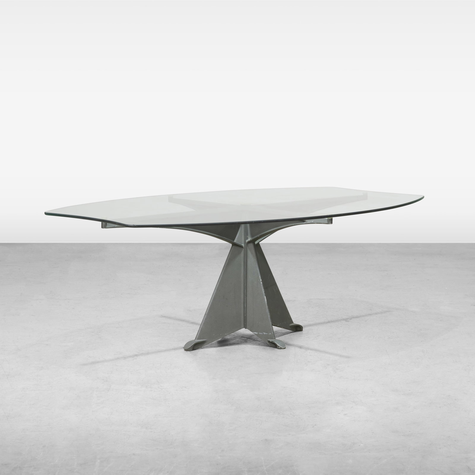 Oscar Tusquets - Dining Table: A glass top dining table on aluminum base by Oscar Tusquets. All measurements are in inches. Height x Width x Depth