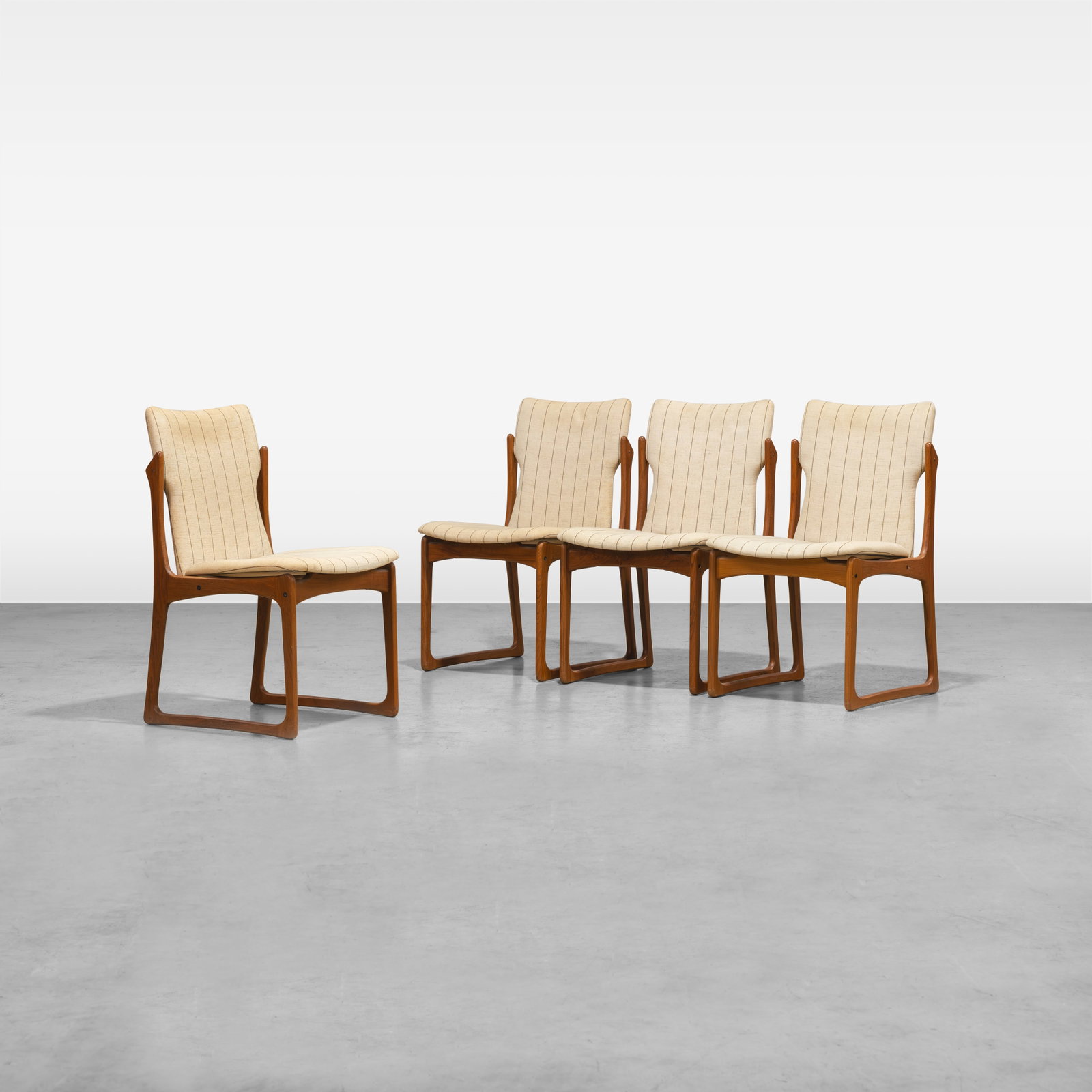Danish Teak Dining Chairs: A set of four Danish teak dining chairs. All measurements are in inches. Height x Width x Depth
