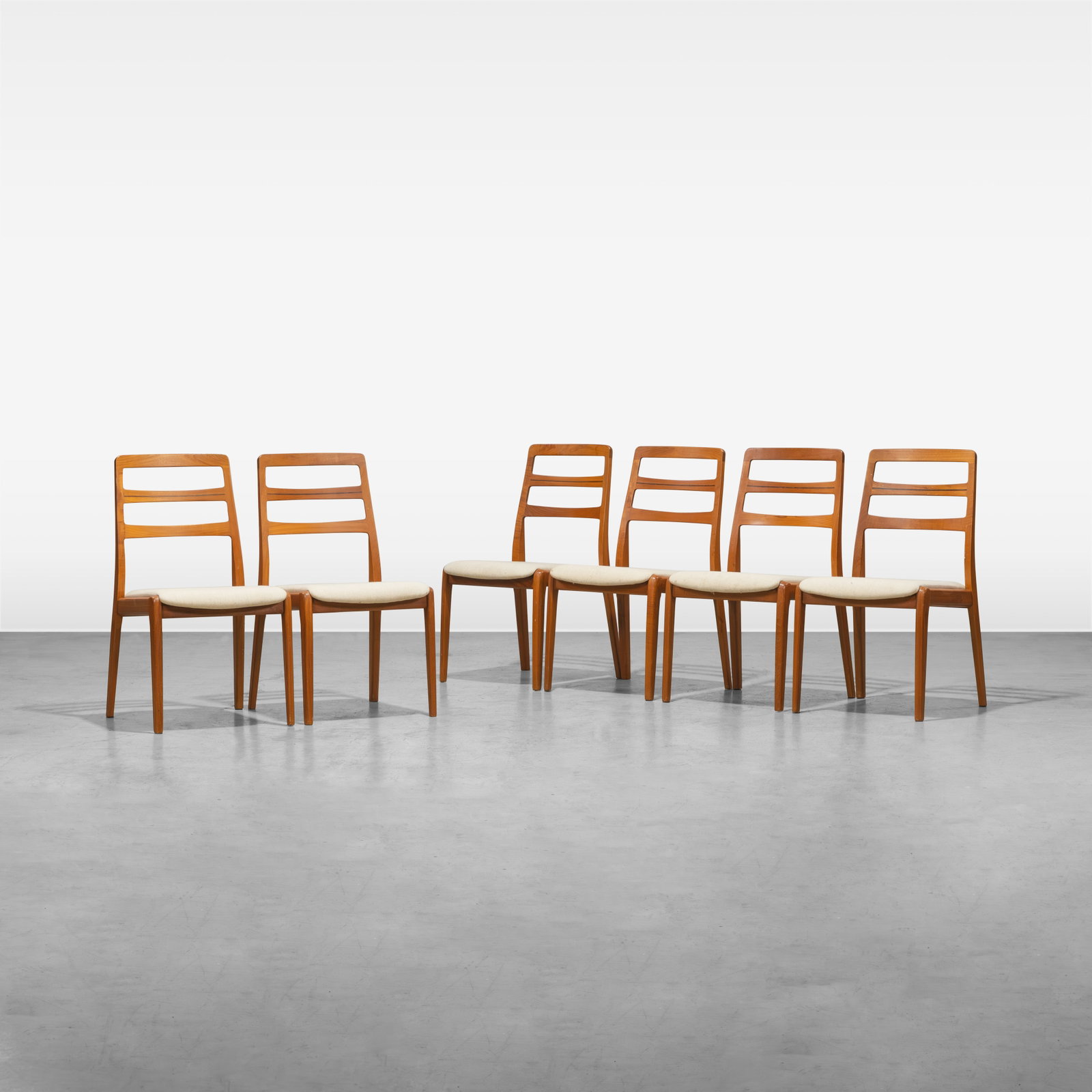 Danish Teak Dining Chairs: A set of six Danish teak ladder back dining chairs with inlaid rosewood. Unmarked. All measurements are in inches. Height x Width x Depth