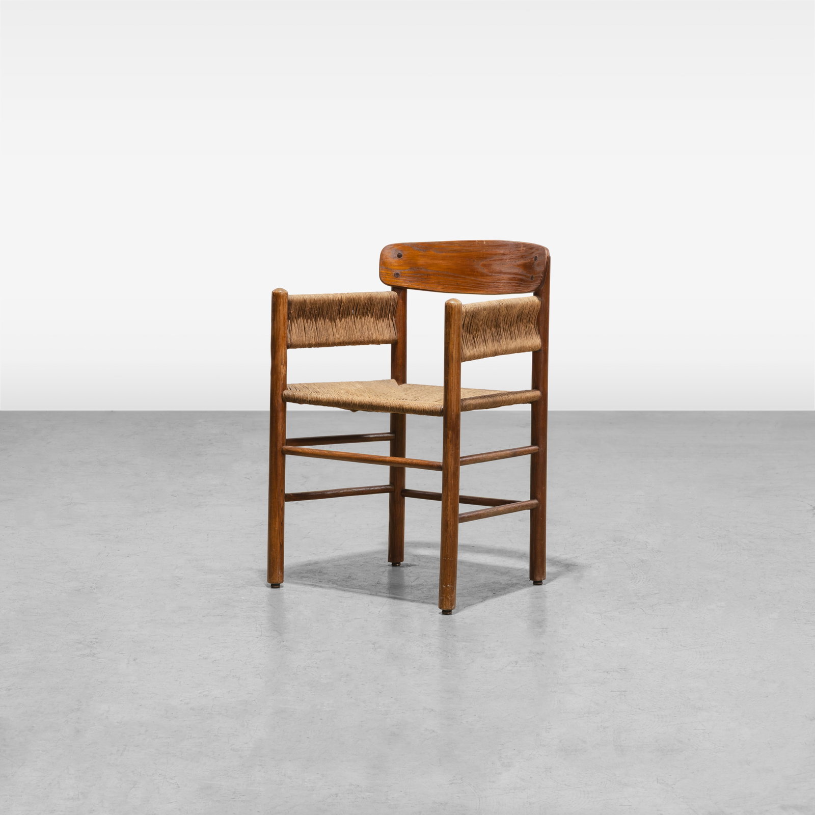 Borge Mogensen - Armchair: A teak and cord armchair by Borge Mogensen. All measurements are in inches. Height x Width x Depth