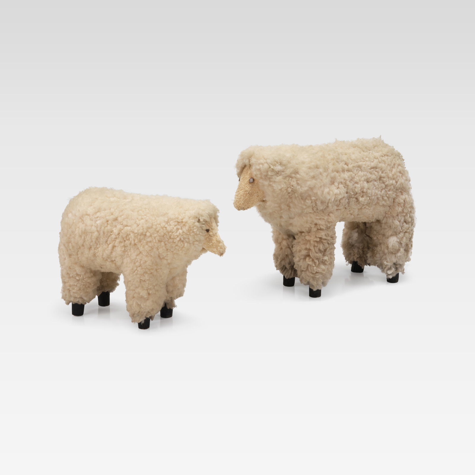 Primitive Sheep Sculptures: Two primitive sheep sculptures. Small sheep - 13 x 8.5 x 18. All measurements are in inches. Height x Width x Depth