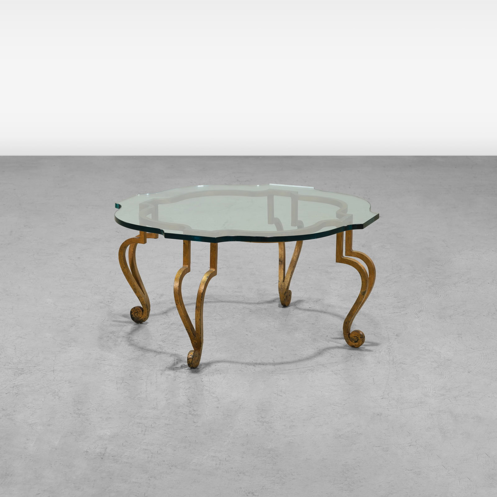 Gilt Metal Coffee Table: A gilt metal and glass coffee table. All measurements are in inches. Height x Width x Depth
