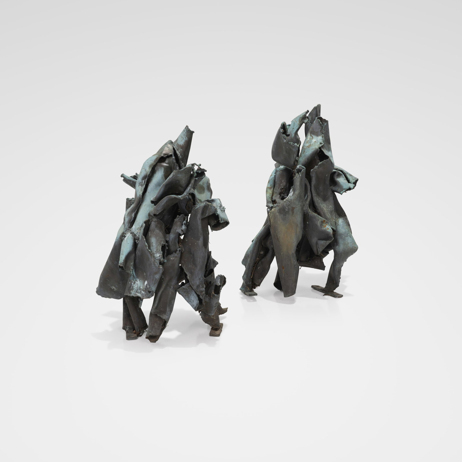 Copper Sculptures: A pair of abstract copper sculptures. All measurements are in inches. Height x Width x Depth