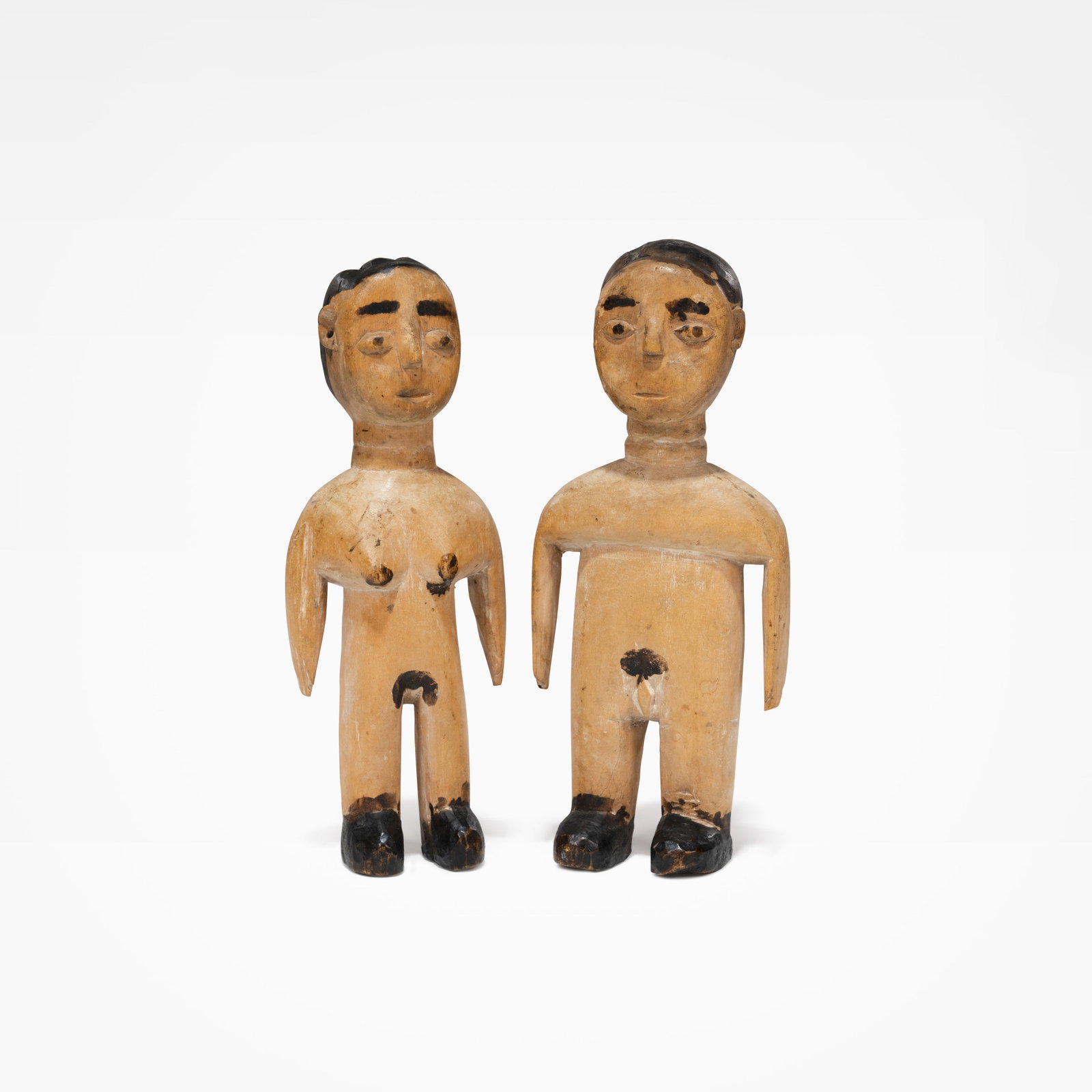 Fertility Sculptures: A pair of carved wood fertility sculptures. All measurements are in inches. Height x Width x Depth