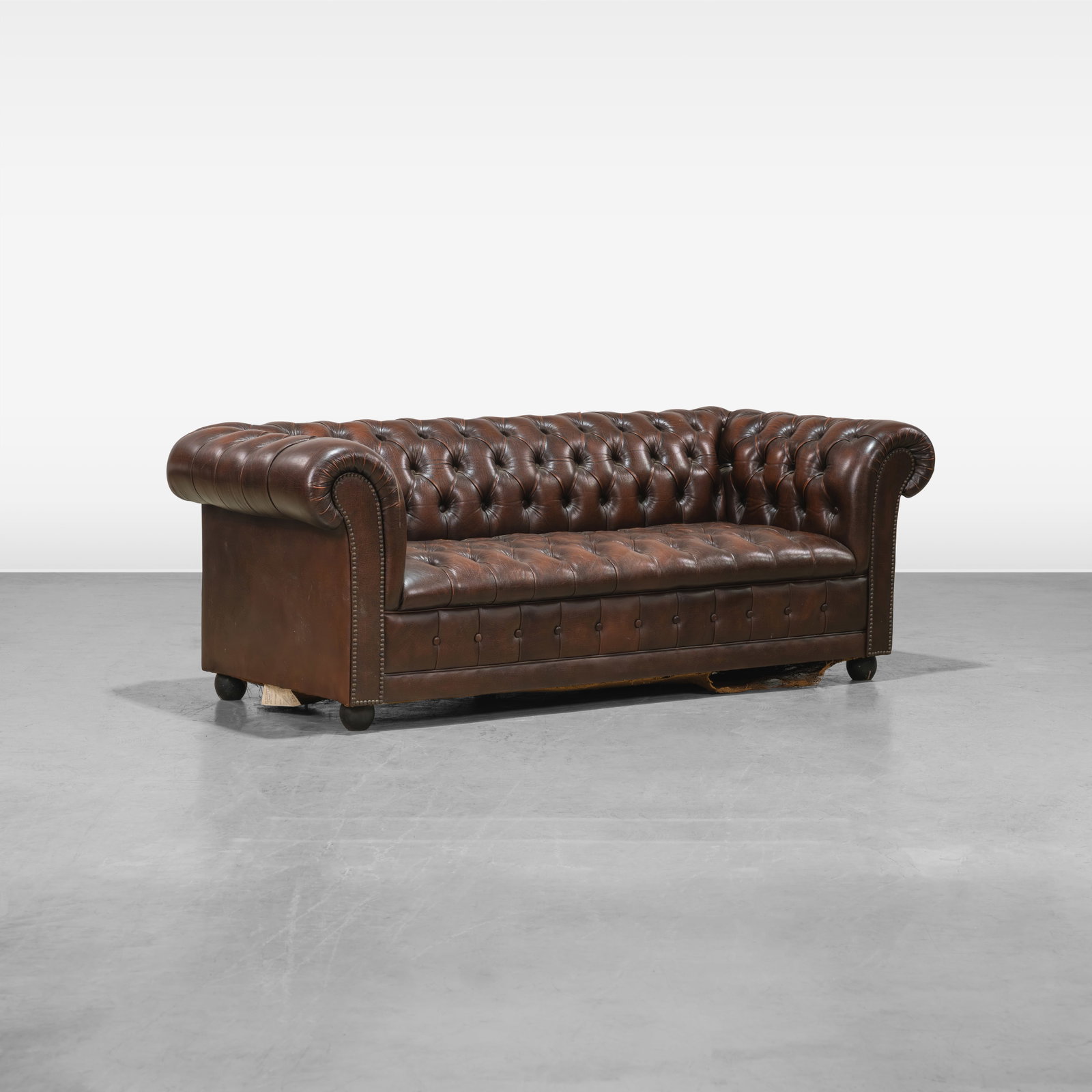 Leather Chesterfield Sofa: A tufted leather Chesterfield sofa. All measurements are in inches. Height x Width x Depth