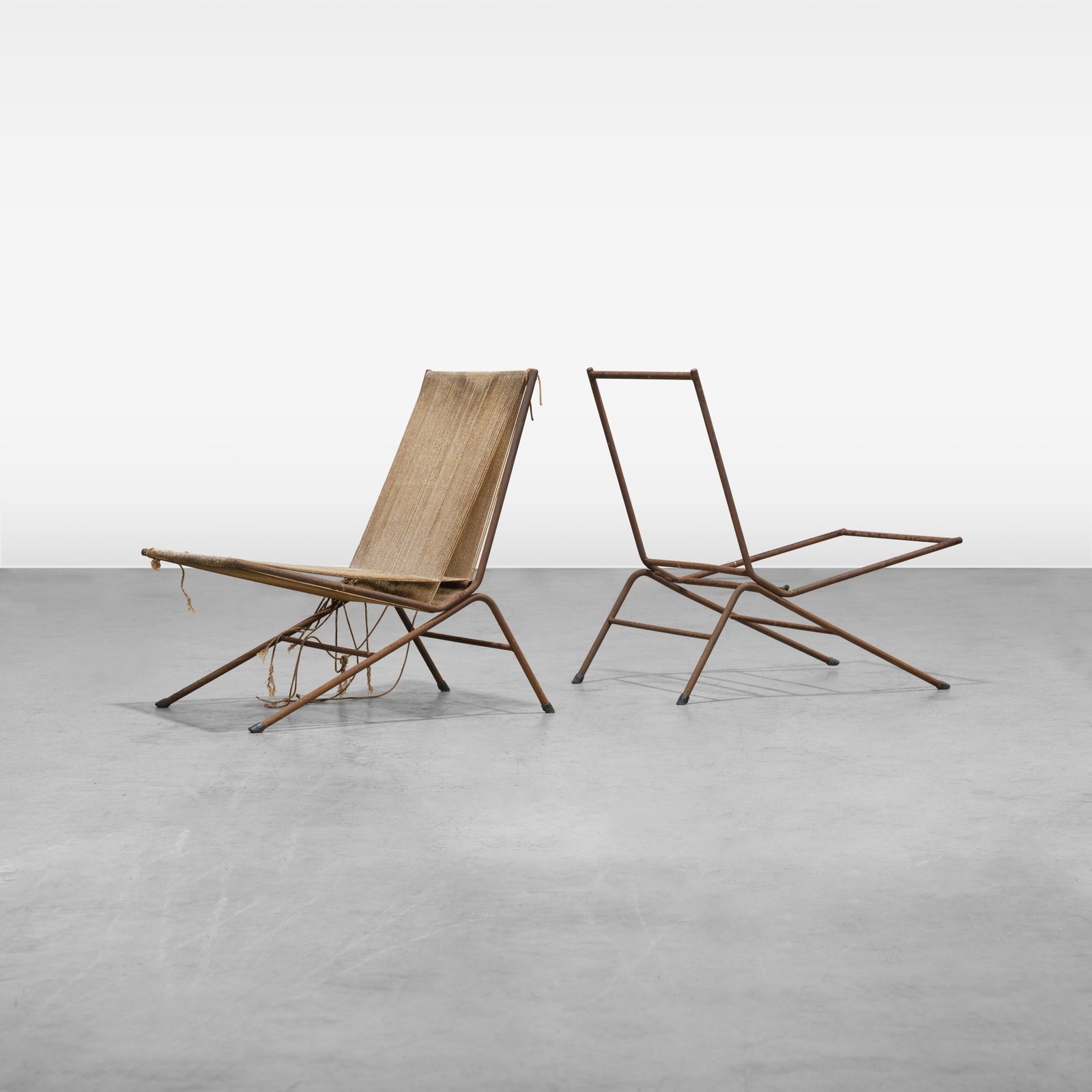 Allan Gould - Lounge Chairs: A pair of Allan Gould 'String' lounge chairs. All measurements are in inches. Height x Width x Depth