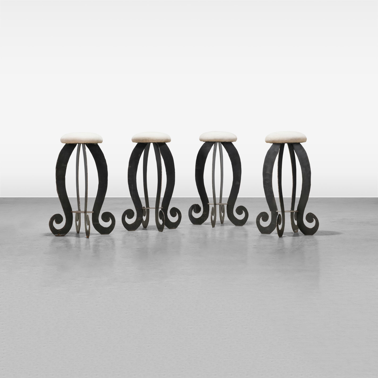 Torch Cut Steel Bar Stools: A set of four torch cut steel stools. All measurements are in inches. Height x Width x Depth