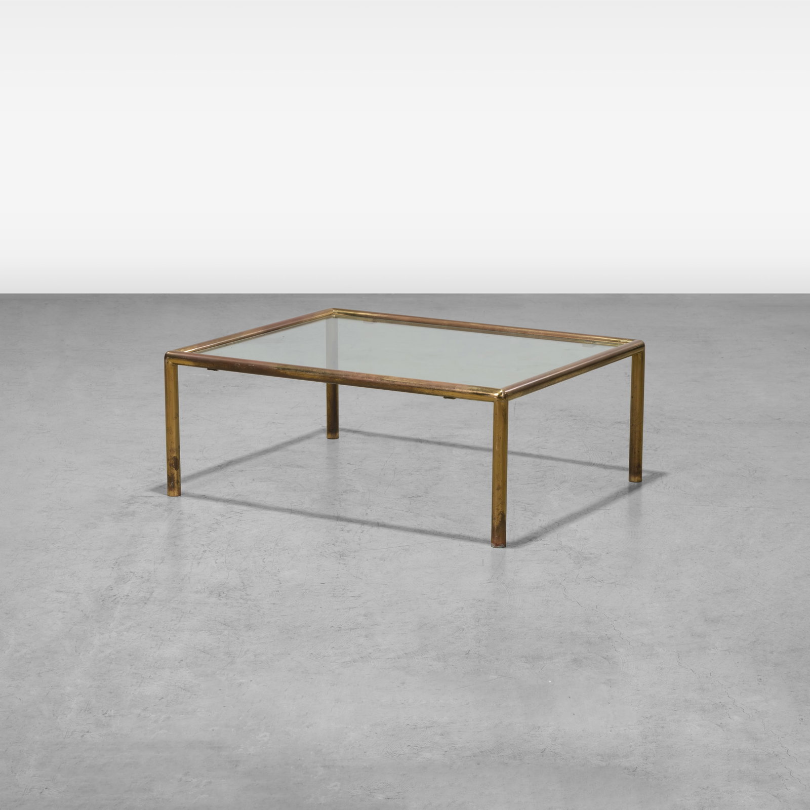 Brass & Glass Coffee Table: A vintage tubular brass and glass coffee table. All measurements are in inches. Height x Width x Depth
