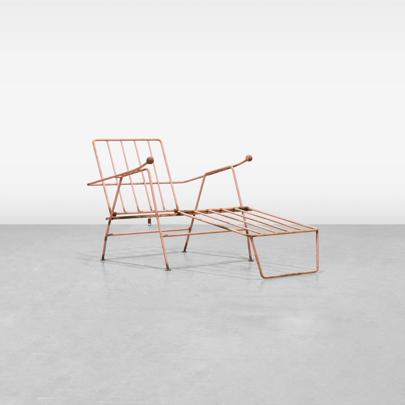 Modernist Iron Lounge Chair: A vintage modernist iron patio chair. Dimensions listed are with footrest down. All measurements are in inches. Height x Width x Depth