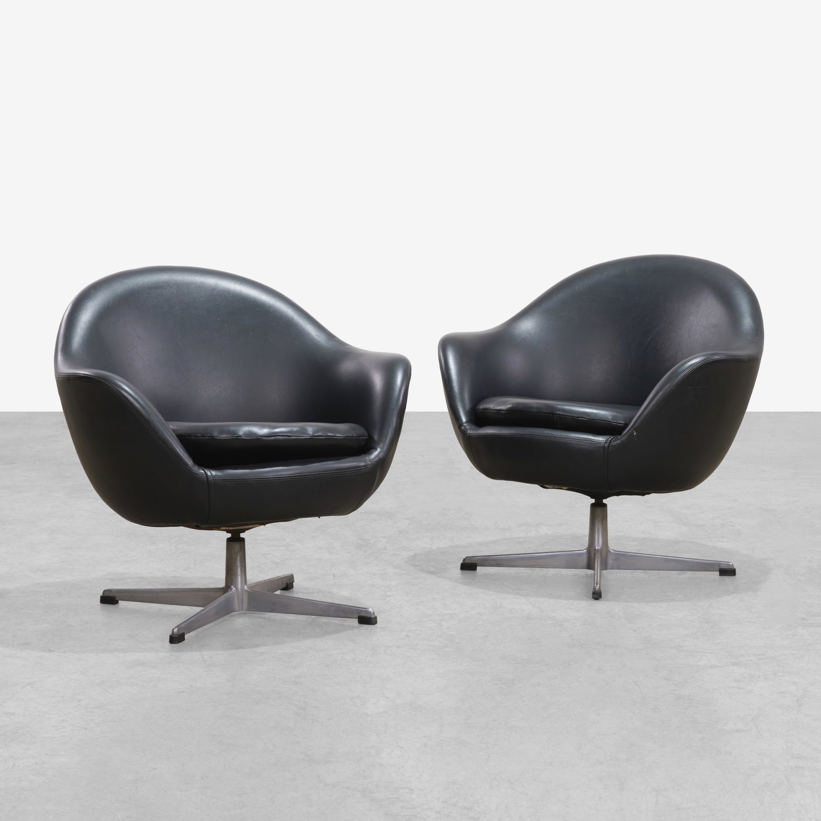 Overman - Pod Chairs: A pair of swiveling pod chairs by Overman, Sweden. All measurements are in inches. Height x Width x Depth
