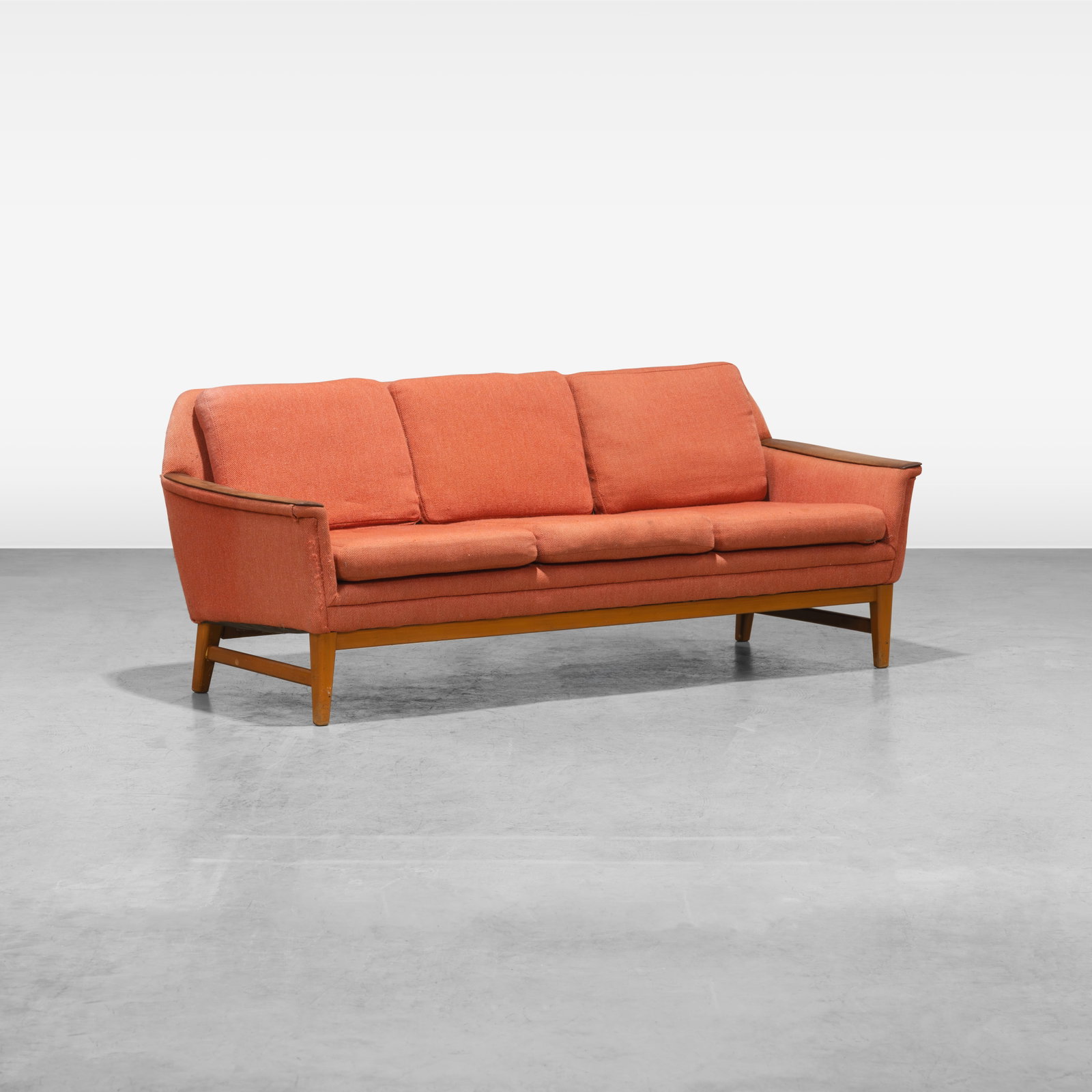 Danish Sofa: A Danish sofa with teak paddle arms. All measurements are in inches. Height x Width x Depth