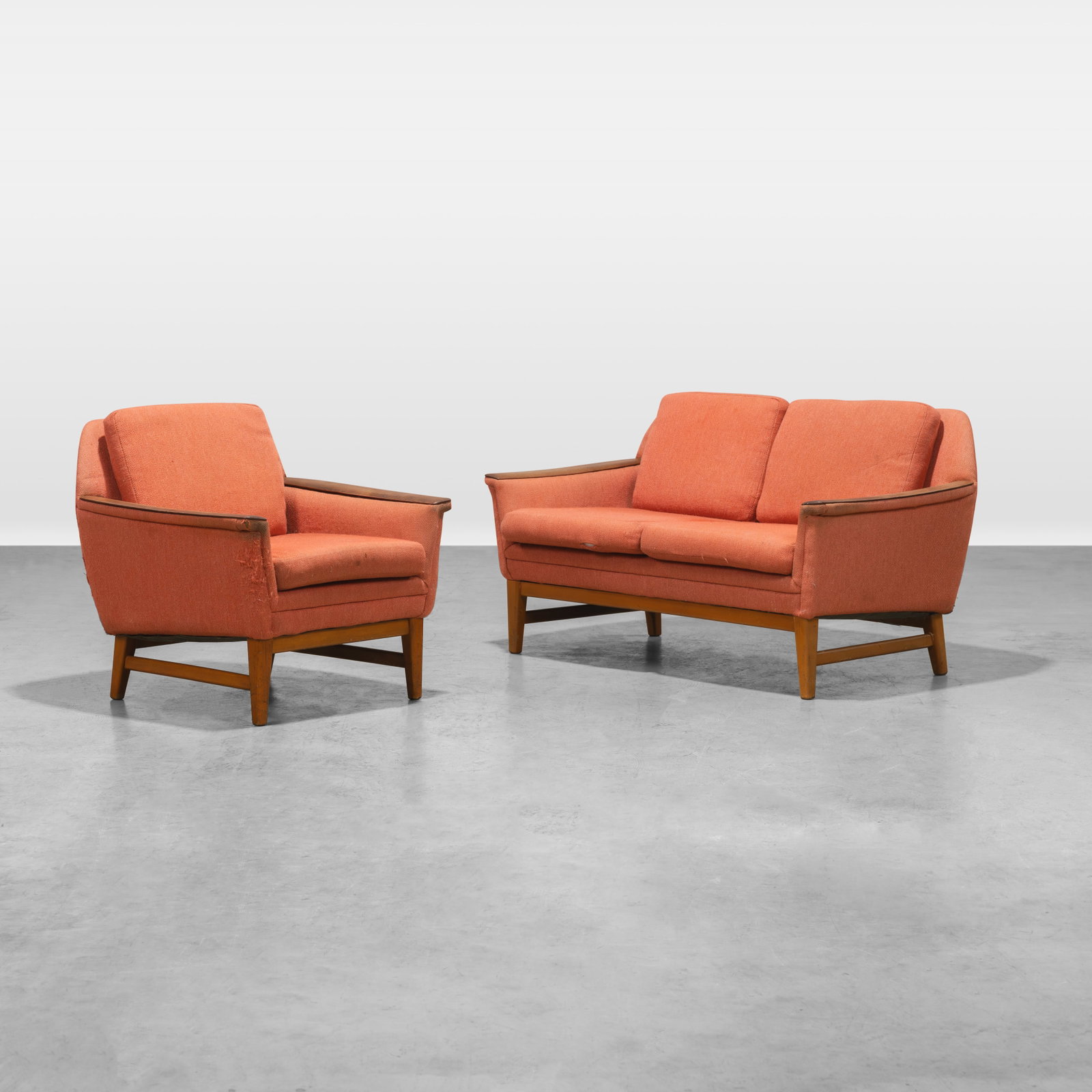 Danish Seating Group: A vintage Danish loveseat and matching chair with teak paddle arms. Dimensions listed are for the loveseat. Chair - 28.5 x 30.5 x 30. All measurements are in inches. Height x Width x Depth