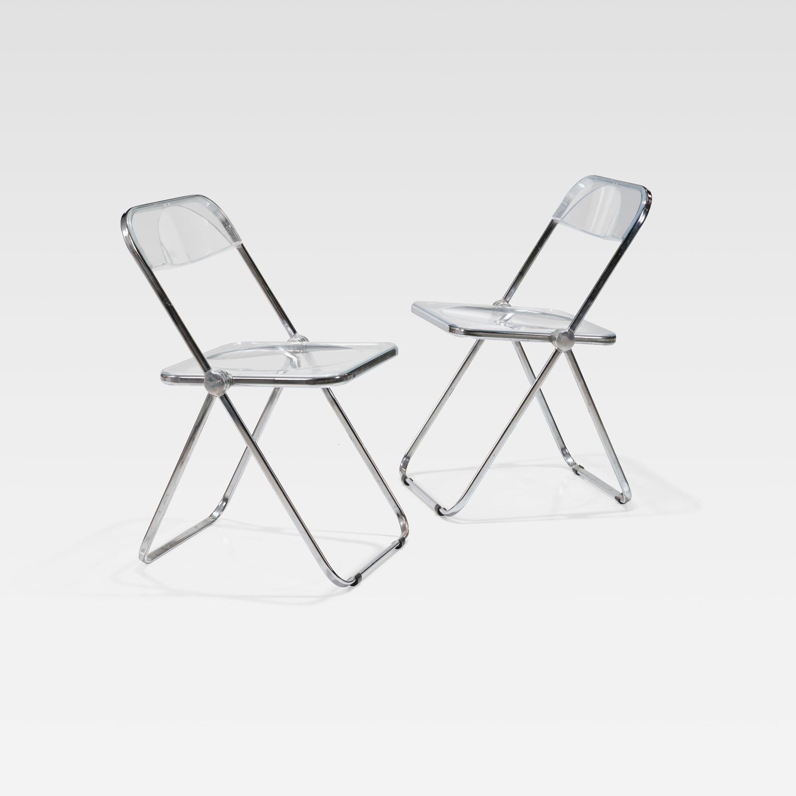 Giancarlo Piretti - Plia Chairs: A set of two vintage 'Plia' chairs by Giancarlo Piretti for Anonima Castelli, Italy. All measurements are in inches. Height x Width x Depth