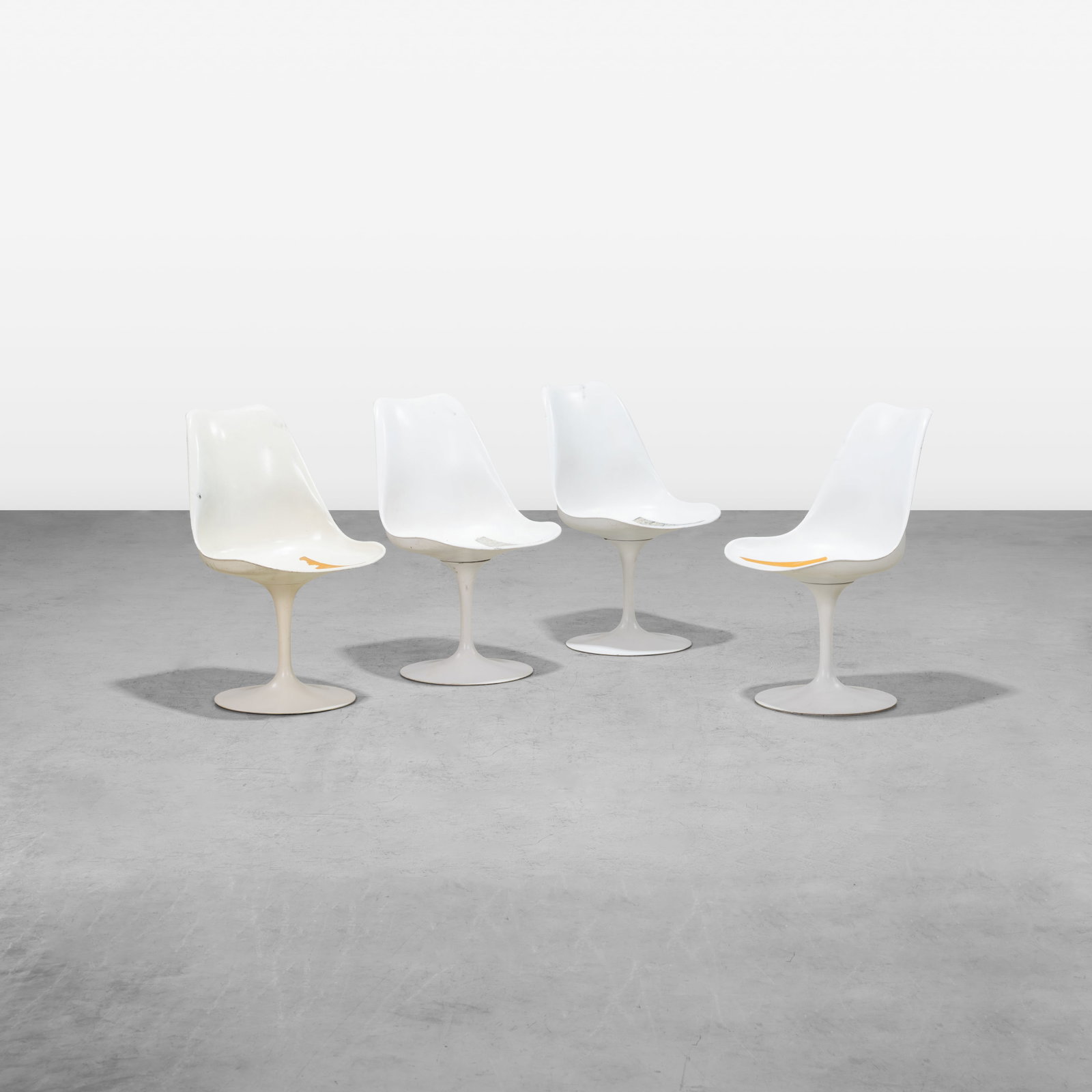 Eero Saarinen - Chairs: A set of four tulip side chairs by Eero Saarinen for Knoll. All measurements are in inches. Height x Width x Depth