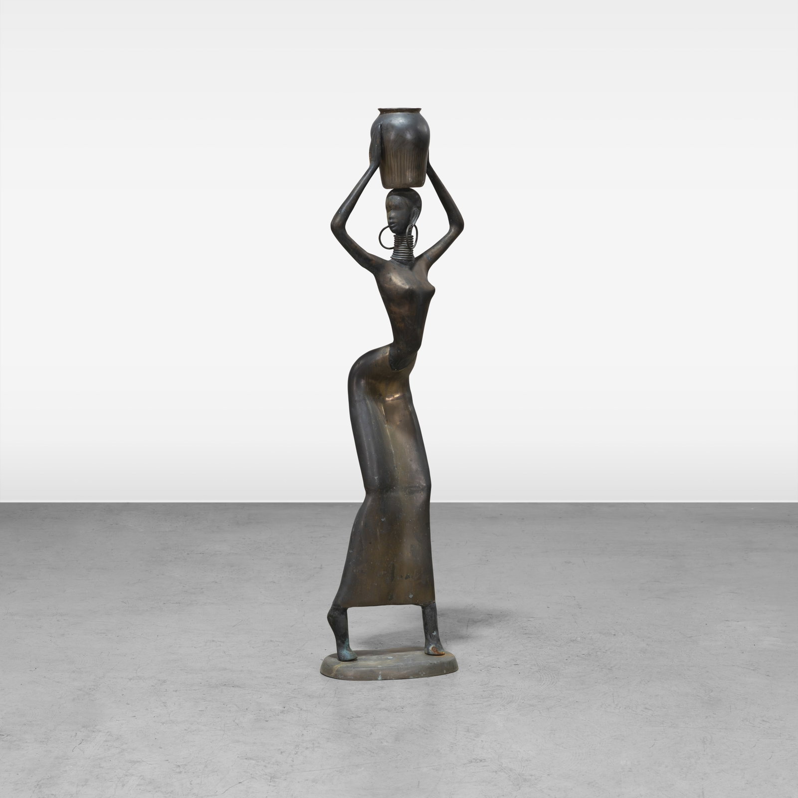 Bronze African Woman: An Art Deco style life size bronze African woman. All measurements are in inches. Height x Width x Depth