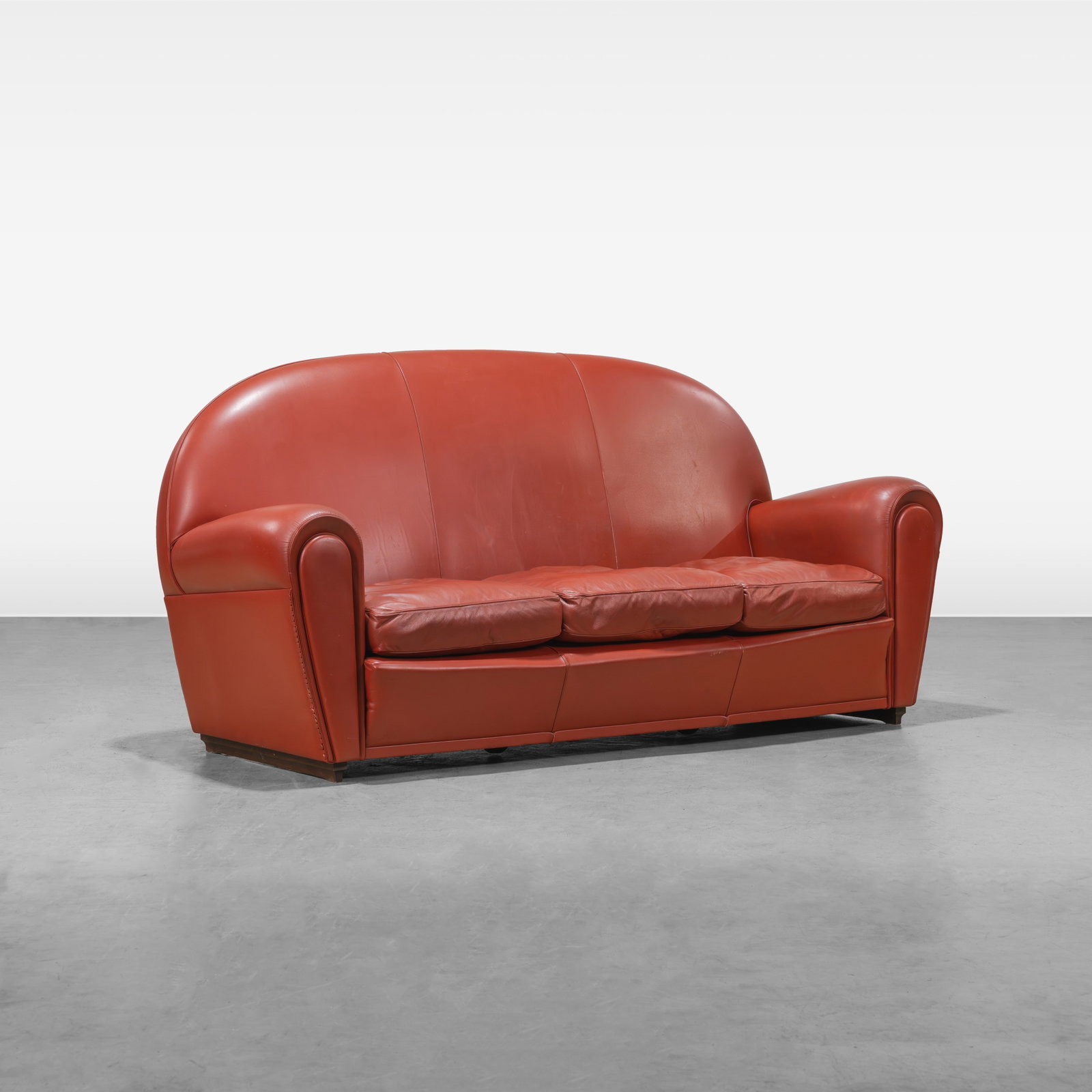 Poltrona Frau - Leather Sofa: A red leather 'Vanity Fair' sofa by Poltrona Frau, Italy. All measurements are in inches. Height x Width x Depth