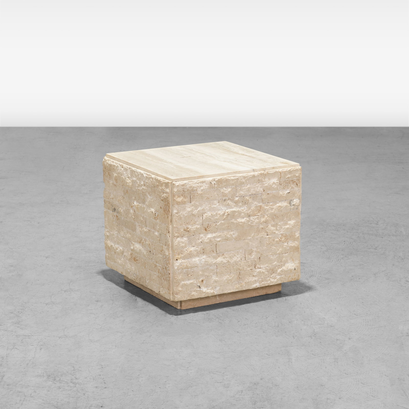 Italian Travertine Pedestal Table: An Italian travertine pedestal table with tessellated stone sides. All measurements are in inches. Height x Width x Depth