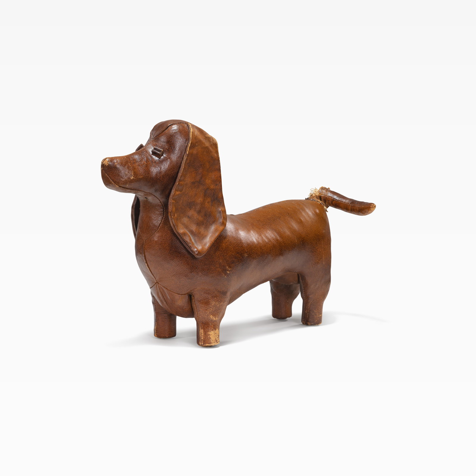 Leather Dog: A leather dog in the manner of Omersa, produced by Sarreid, Spain. All measurements are in inches. Height x Width x Depth