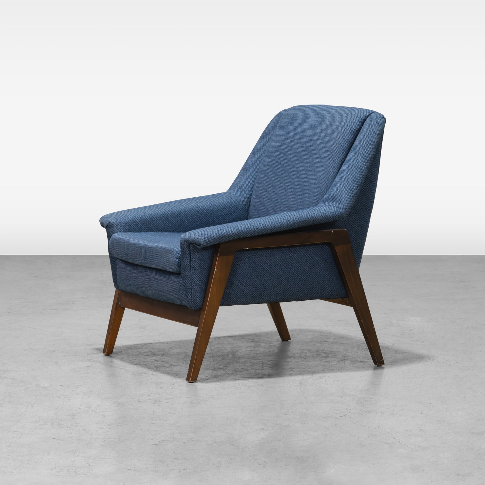 Vintage Lounge Chair: A vintage lounge chair in the manner of Folke Ohlsson. All measurements are in inches. Height x Width x Depth
