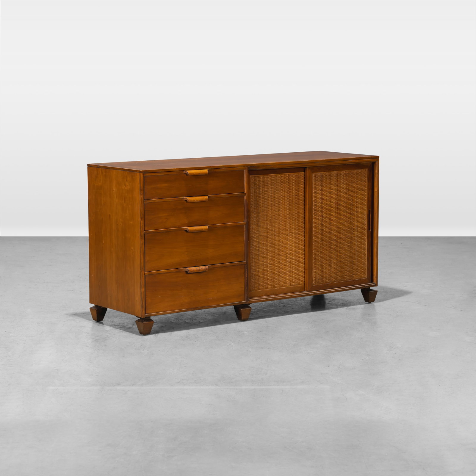 Tomlinson - Buffet: A 'Parkway Terrace' buffet with woven cane doors that contain adjustable shelves by Tomlinson. All measurements are in inches. Height x Width x Depth