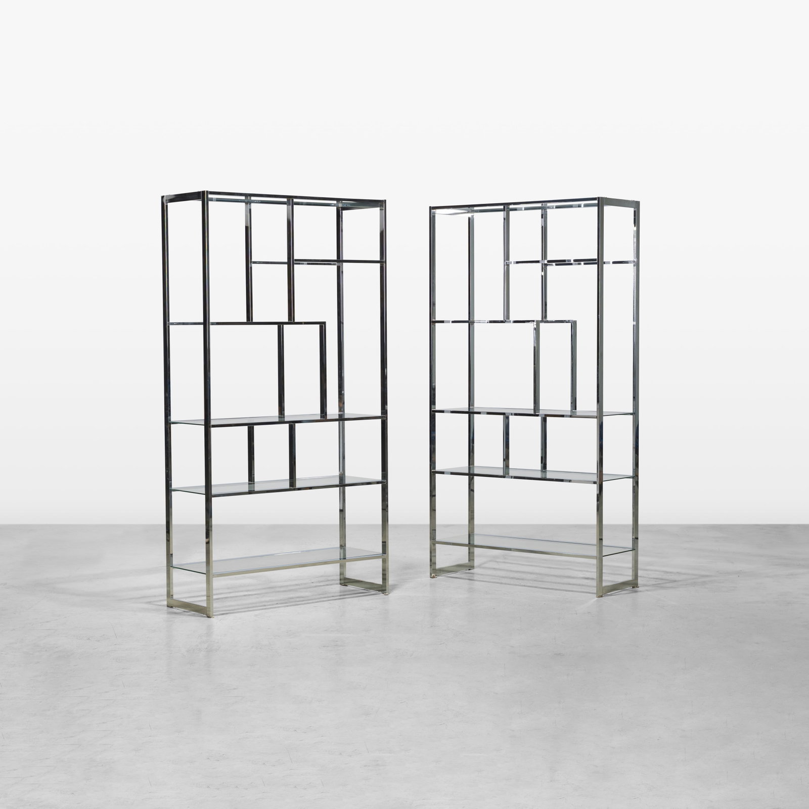 Chrome Etageres: A pair of vintage chrome etageres in the manner of Milo Baughman. All measurements are in inches. Height x Width x Depth