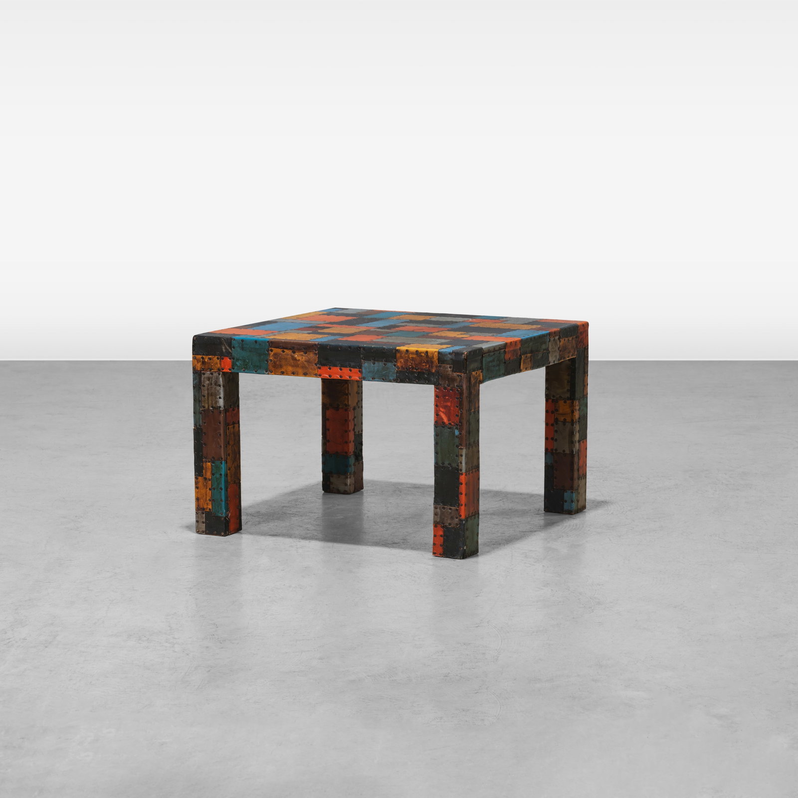 Patchwork Leather Table: A patchwork leather table. All measurements are in inches. Height x Width x Depth