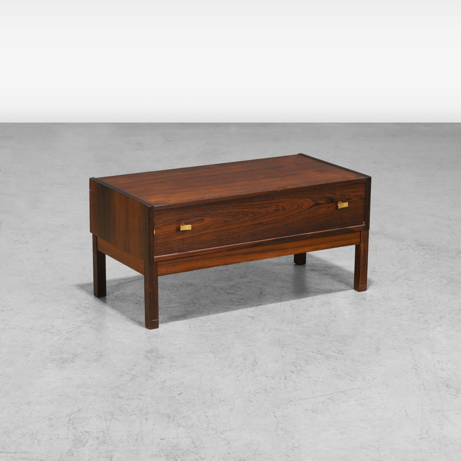 Poul Norreklit - Low Chest: A rosewood and brass low chest by Poul Norreklit. All measurements are in inches. Height x Width x Depth