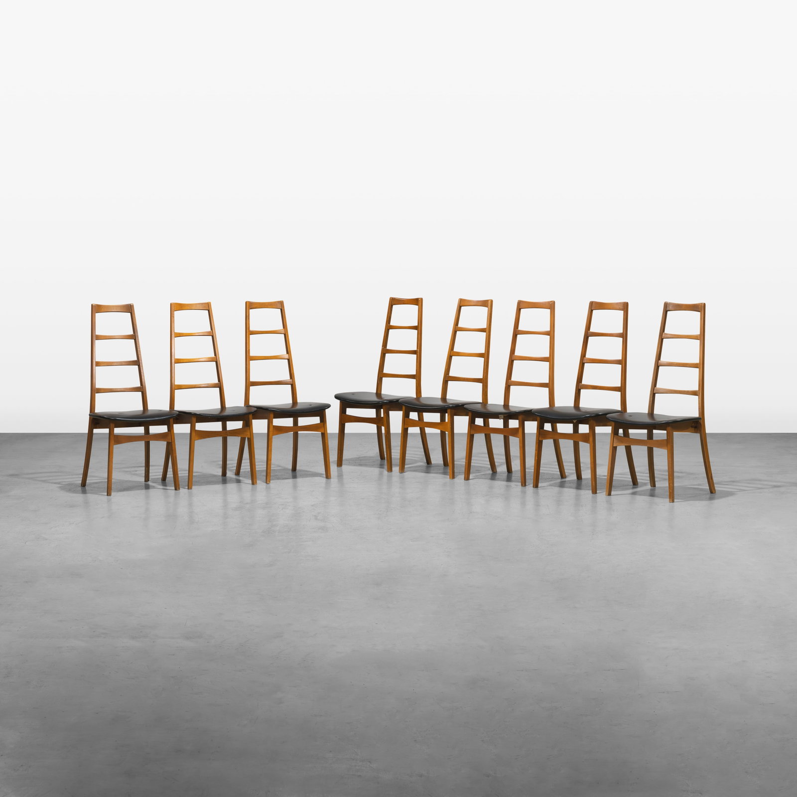 Vintage Ladder Back Dining Chairs: A set of eight vintage ladder back dining chairs. Made in Yugoslavia. All measurements are in inches. Height x Width x Depth