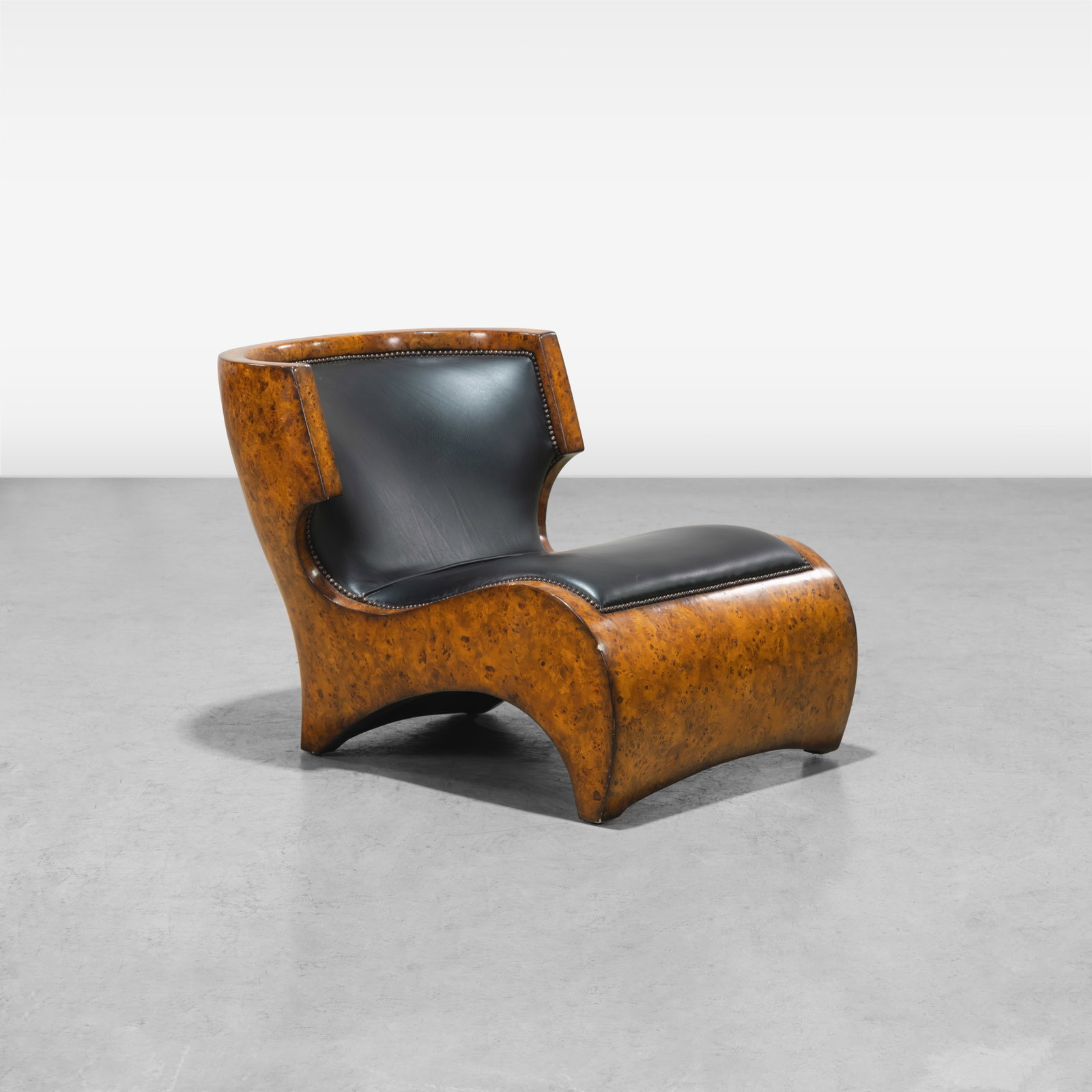 Designer Burl Lounge Chair: A leather and burl designer lounge chair. All measurements are in inches. Height x Width x Depth