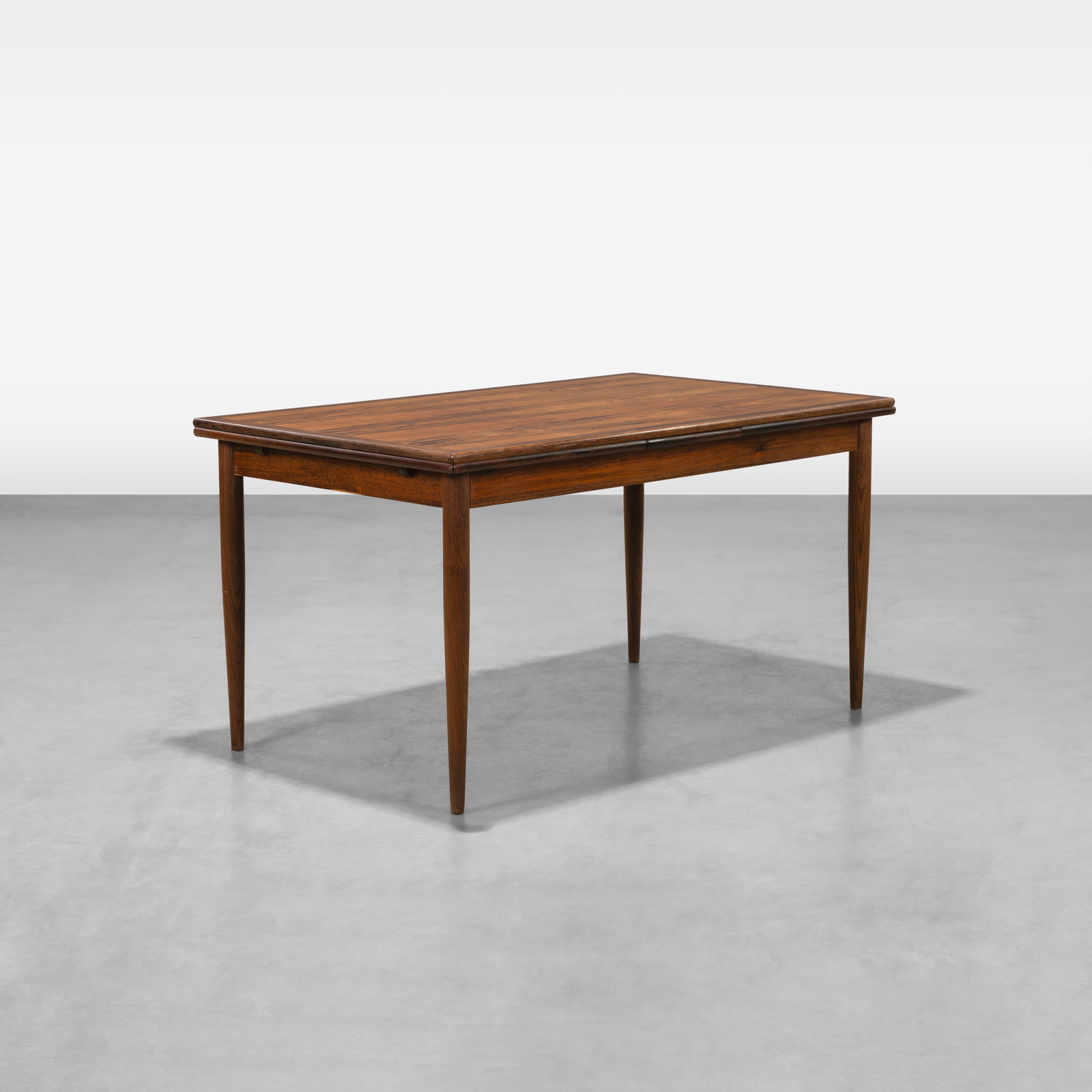 Rosewood Dining Table: A vintage rosewood dining table with pull out leaves. All measurements are in inches. Height x Width x Depth