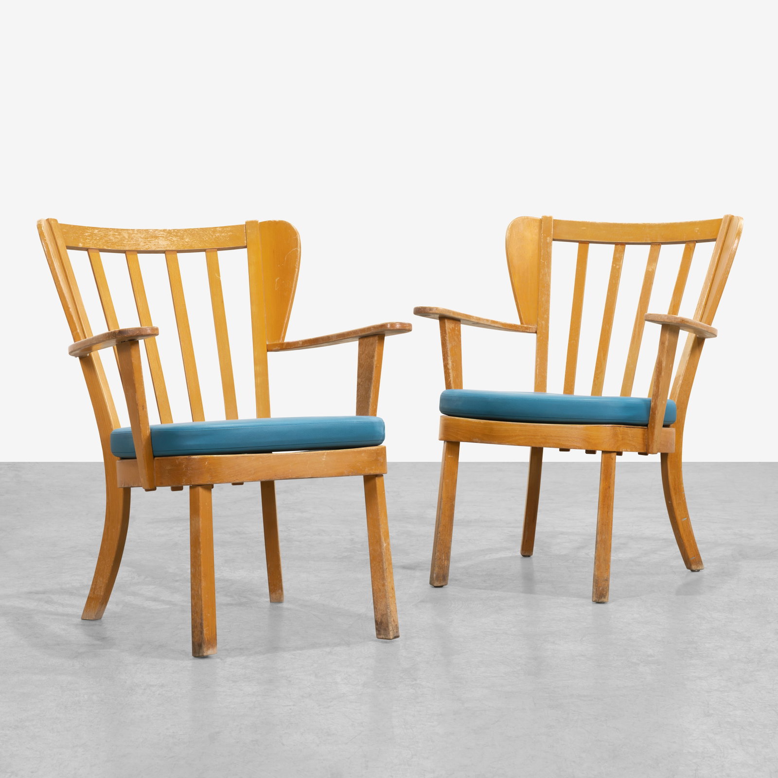 Christian Hansen - Armchairs: A pair of vintage 'Canada' chairs by Christian Hansen for Fritz Hansen. Label on bottom. All measurements are in inches. Height x Width x Depth