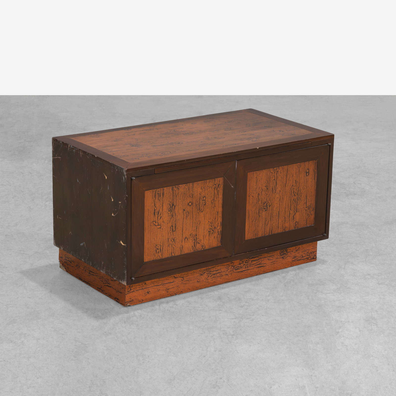 Renzo Rutili - Cabinet: A walnut and embossed copper low cabinet with pull-out tablet by Renzo Rutili. All measurements are in inches. Height x Width x Depth
