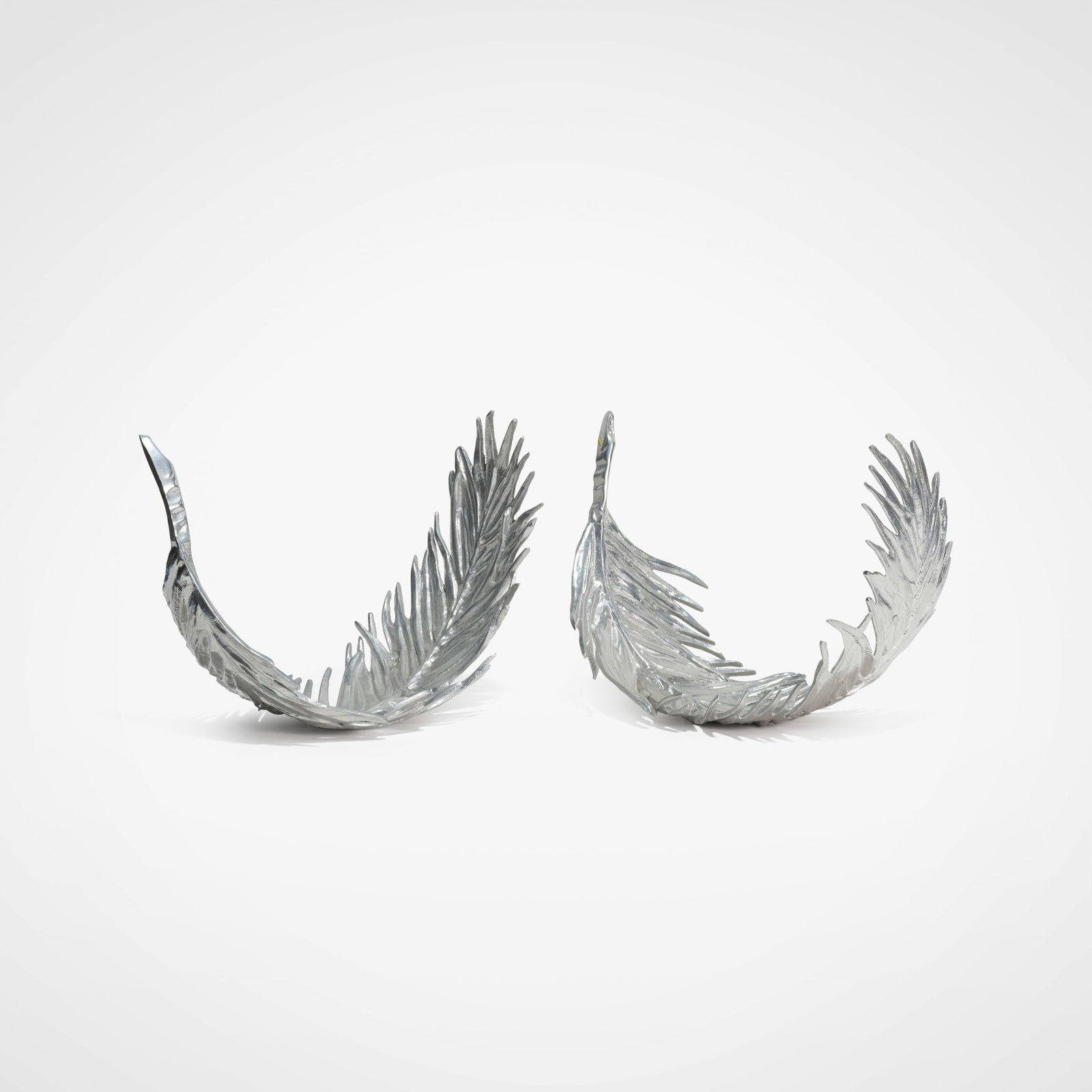 Arthur Court - Feather Sculptures: A pair of cast aluminum feathers by Arthur Court. Stamped on underside, dated 1977. All measurements are in inches. Height x Width x Depth