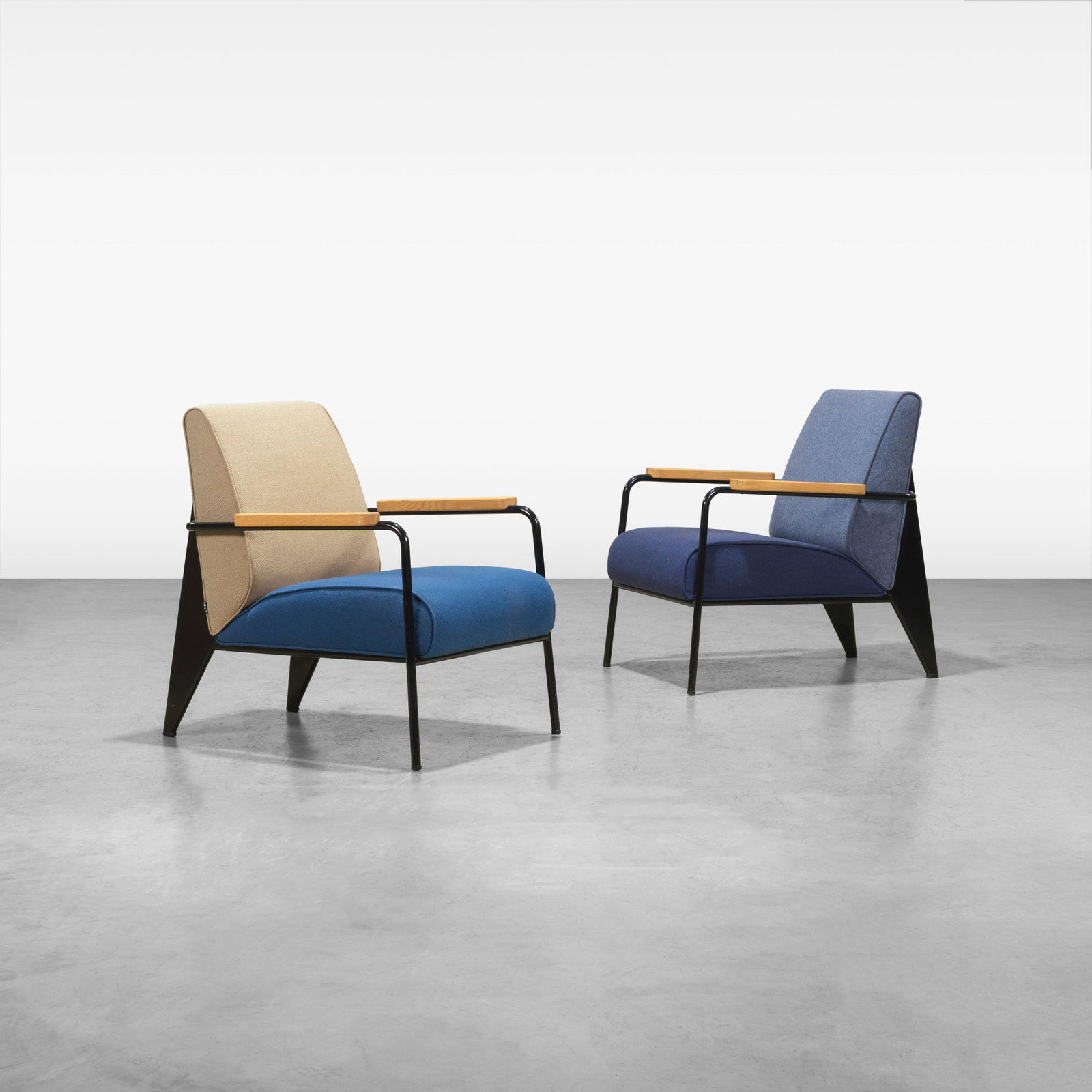 Jean Prouve - Lounge Chairs: A pair of steel, oak, and wool 'Salon' chairs by Jean Prouve for Vitra. Label on underside. All measurements are in inches. Height x Width x Depth