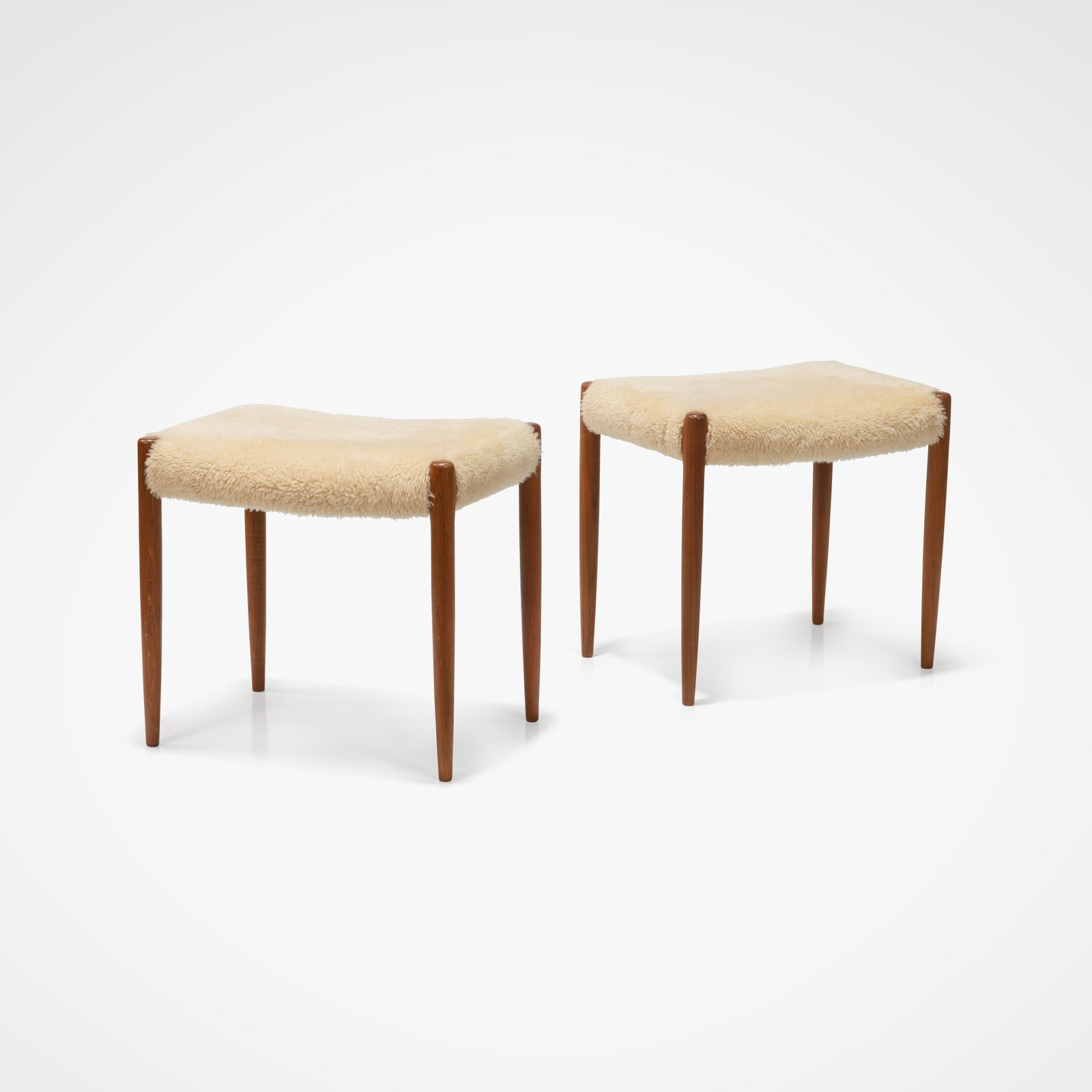 Niels Moller - Stools: A pair of teak and shearling stools by Niels Moller for J. L. Moller. All measurements are in inches. Height x Width x Depth