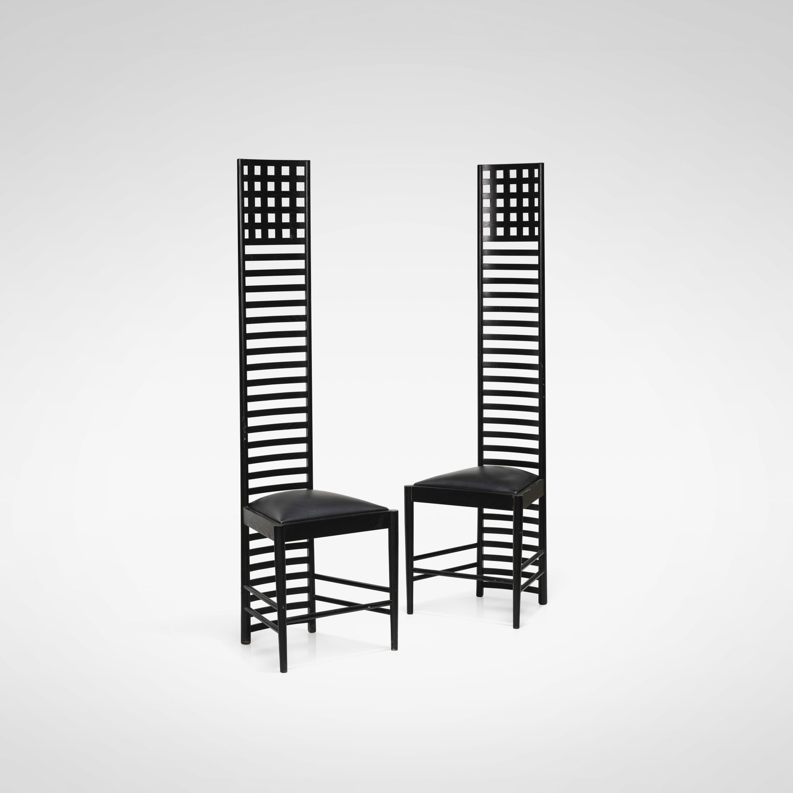 Charles Rennie Mackintosh (After) - Chairs: A pair of tall, ladder back chairs in the style of Charles Rennie Mackintosh. All measurements are in inches. Height x Width x Depth