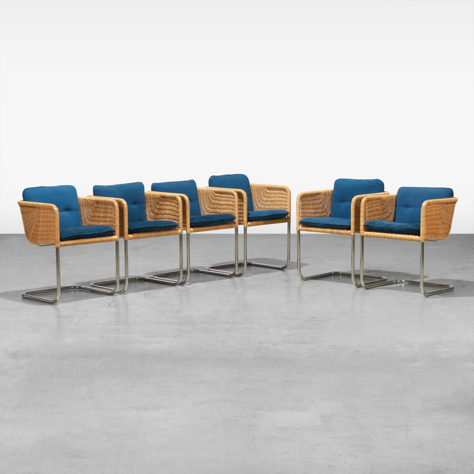 Harvey Probber - Dining Chairs: A set of six wicker and chrome dining chairs by Harvey Probber. All measurements are in inches. Height x Width x Depth