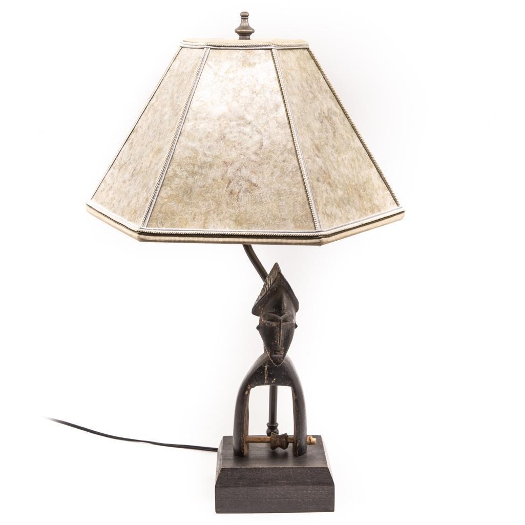 Antique African Spear Thrower Lever Lamp: Antique African Spear Thrower Lever attached to a lamp. It measures 20.5" to the top of the finial