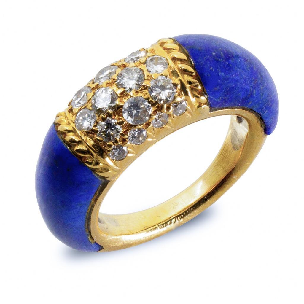 GIA Van Cleef & Arpels, 18kt, Diamond and Lapis Lazuli: Van Cleef & Arpels, Diamond and Lapis Lazuli 'Philippine' Ring containing 18 round brilliant cut diamonds weighing approximately 0.40 carat total and two carved lapis lazuli shoulders.Stamp: VCA NY 5V