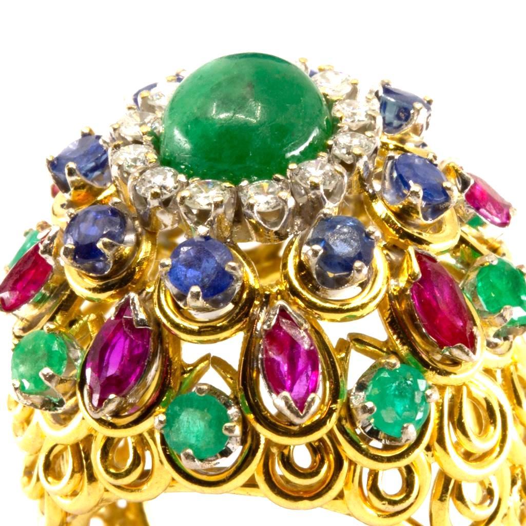 GIA 18k gold Diamond sapphire, ruby and emerald bombe: 18k gold Diamond sapphire, ruby and emerald bombe statement ring with open work mounting. This lot is accompanied by a GIA appraiser letter from an independent and well respected firm established over