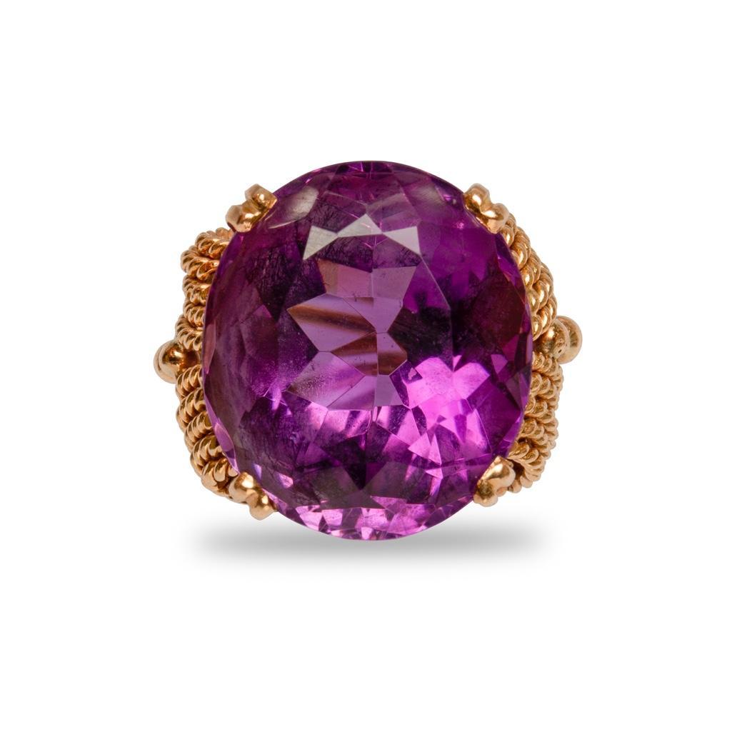 GIA 18k Yellow Gold and Amethyst Cocktail Ring: GIA 18k yellow gold estate vintage cocktail ring, high mount 19.44 ct amethyst stone with 4-prong setting, side rope motifs, beading, and a split shank 7.70 dwt 5.75 ring size; 18.5 mm x 16.4 mm x 12
