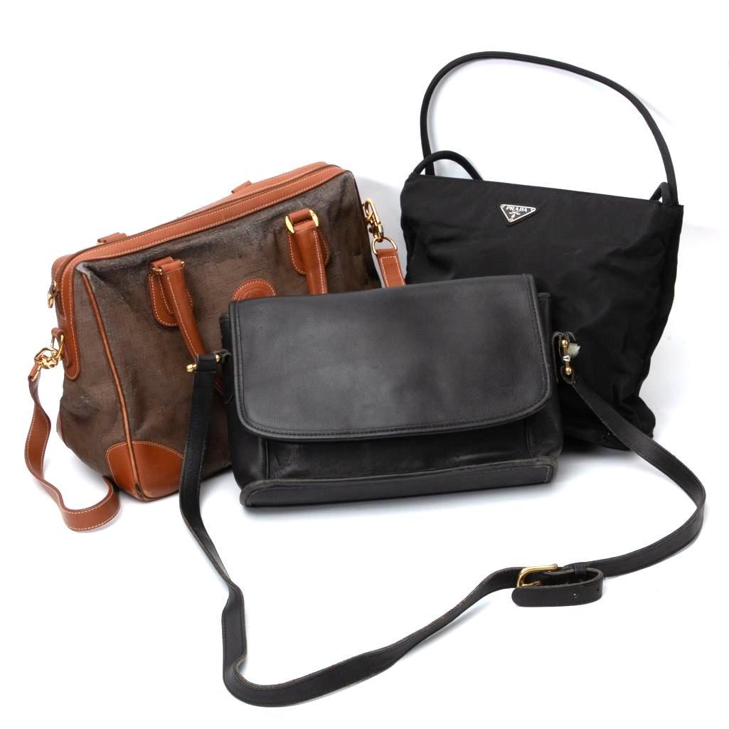 3 Bags, Coach, Prada and Gucci: 3 bags: Coach, Prada and Gucci. Gucci bag measures 13.5"W x 8.75"H Approx. Coach bag Measures 12"W x 7.75"H Approx. Prada Bag Measures 13"W x 9.5"H Approx.