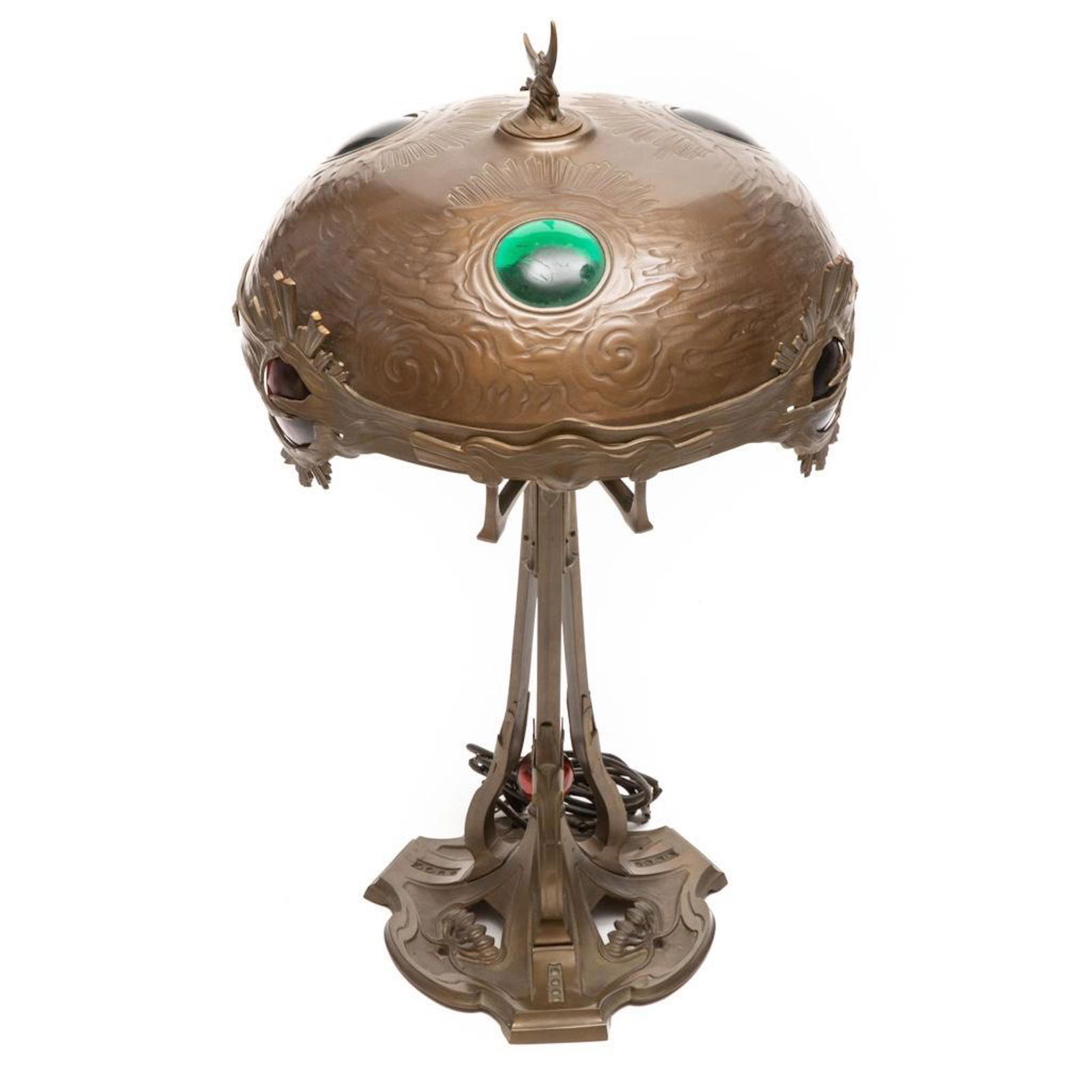 Georges Leleu Style Art Nouveau Table Lamp: Art Nouveau bronze Table Lamp, early 20th century, in the style of Georges Leleu, patinated metal and glass, unmarked, ht. approx. 27, dia. 14 in. One glass shade jewel with chip. Lights but we recomm