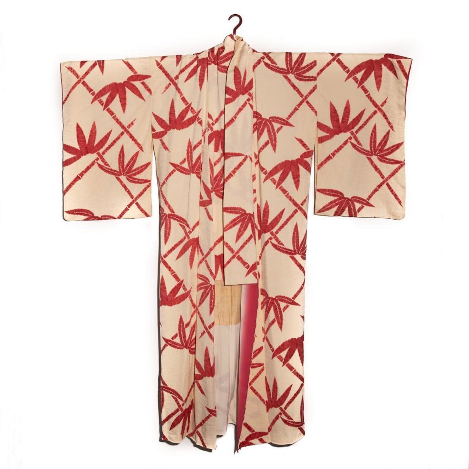 A vintage handwoven silk damask kimono, hand decorated: A vintage handwoven silk damask kimono, hand decorated with shibori tie-dyed design. This kawa pattern off-white damask silk kimono features a red bamboo motif with fawn spot accents. It is lined in t
