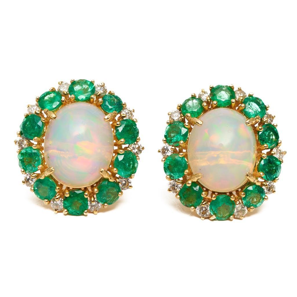 14kt gold, diamond and emerald earrings: PAIR OF 14KT YELLOW GOLD, DIAMOND AND EMERALD EARRINGS Approx. 4.00 carat oval cabochon opals, each 10.0 x 12.0mm, surrounded by round-cut emeralds, each approx. 3.0mm, and brilliant-cut diamonds. Tot
