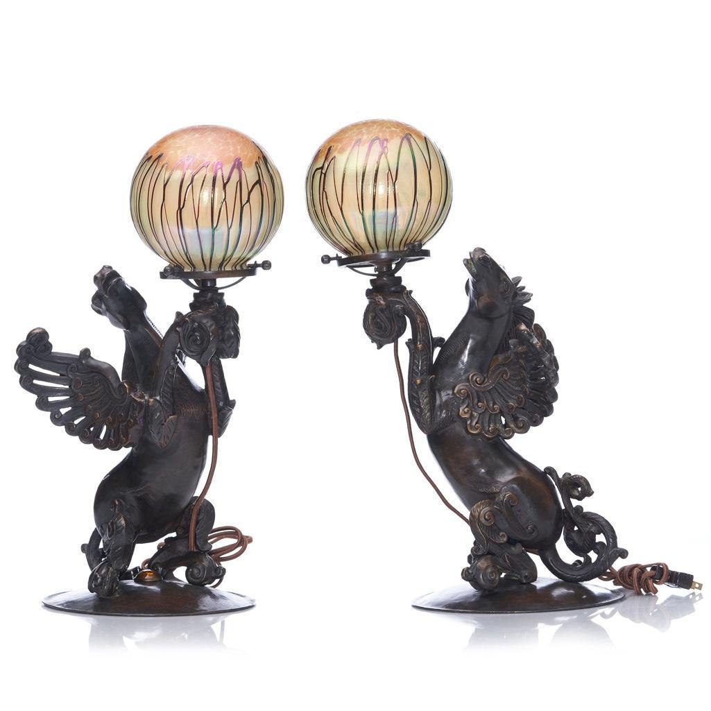 Durand Art Glass Bronze Pegasus Lamps with Martin Bach jr Loetz style Shades: Durand Art Glass Bronze Pegasus Lamps with Martin Bach Jr Loetz- Style ShadesPair of Durand, circa 1930's bronze lamps (attributed). No makers marks found.The Loetz- style art glass globes are typical