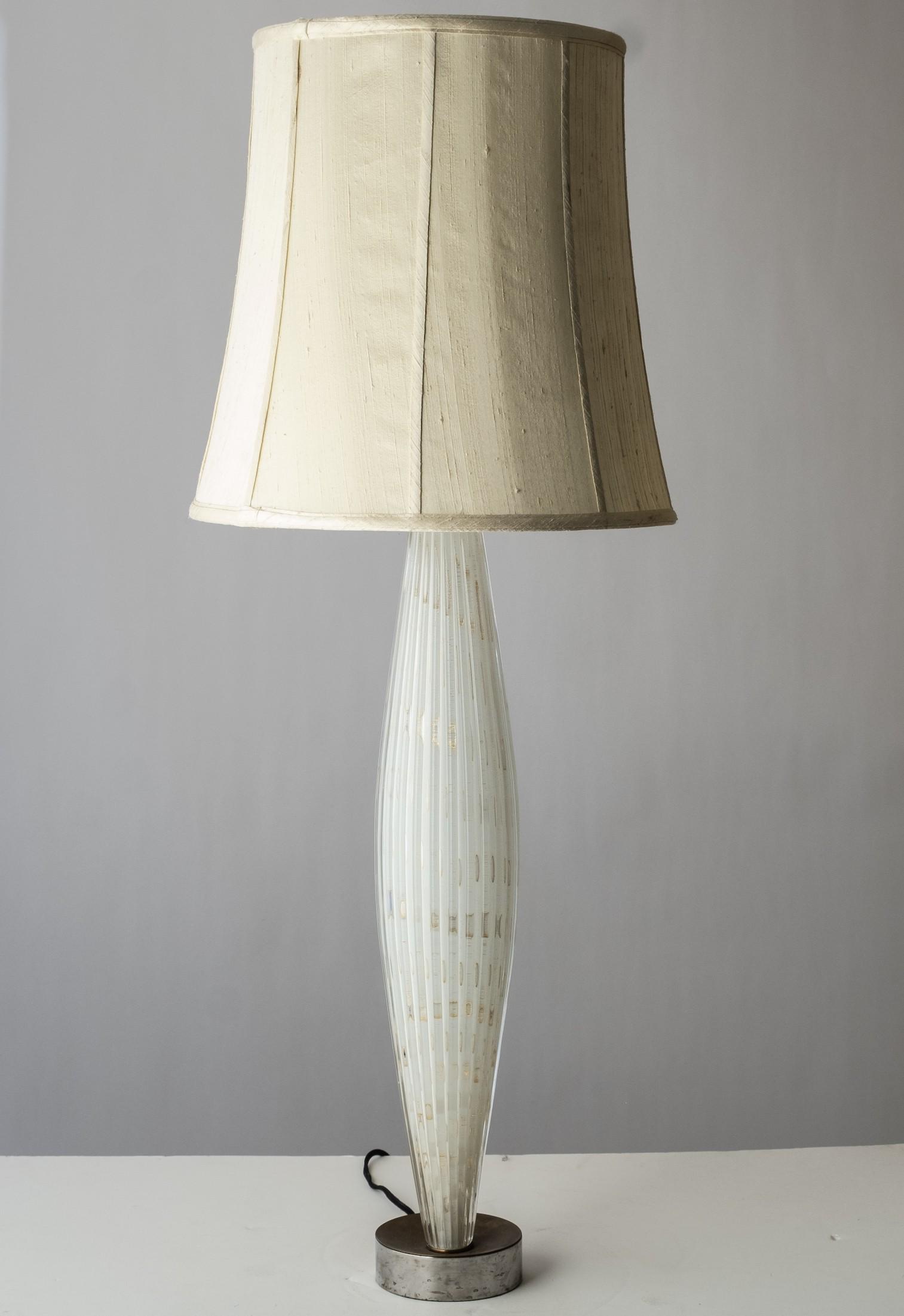 Alfredo Barbini Opaline Ribbed Murano Glass Table Lamp with Silk Shade: Alfredo Barbini Opaline Ribbed Murano Glass Table Lamp with Silk ShadeAlfredo Barbini (Italian, 1912-2007). Tall opaline ribbed glass two-light table lamp having chain pull. Murano art glass, circa 19