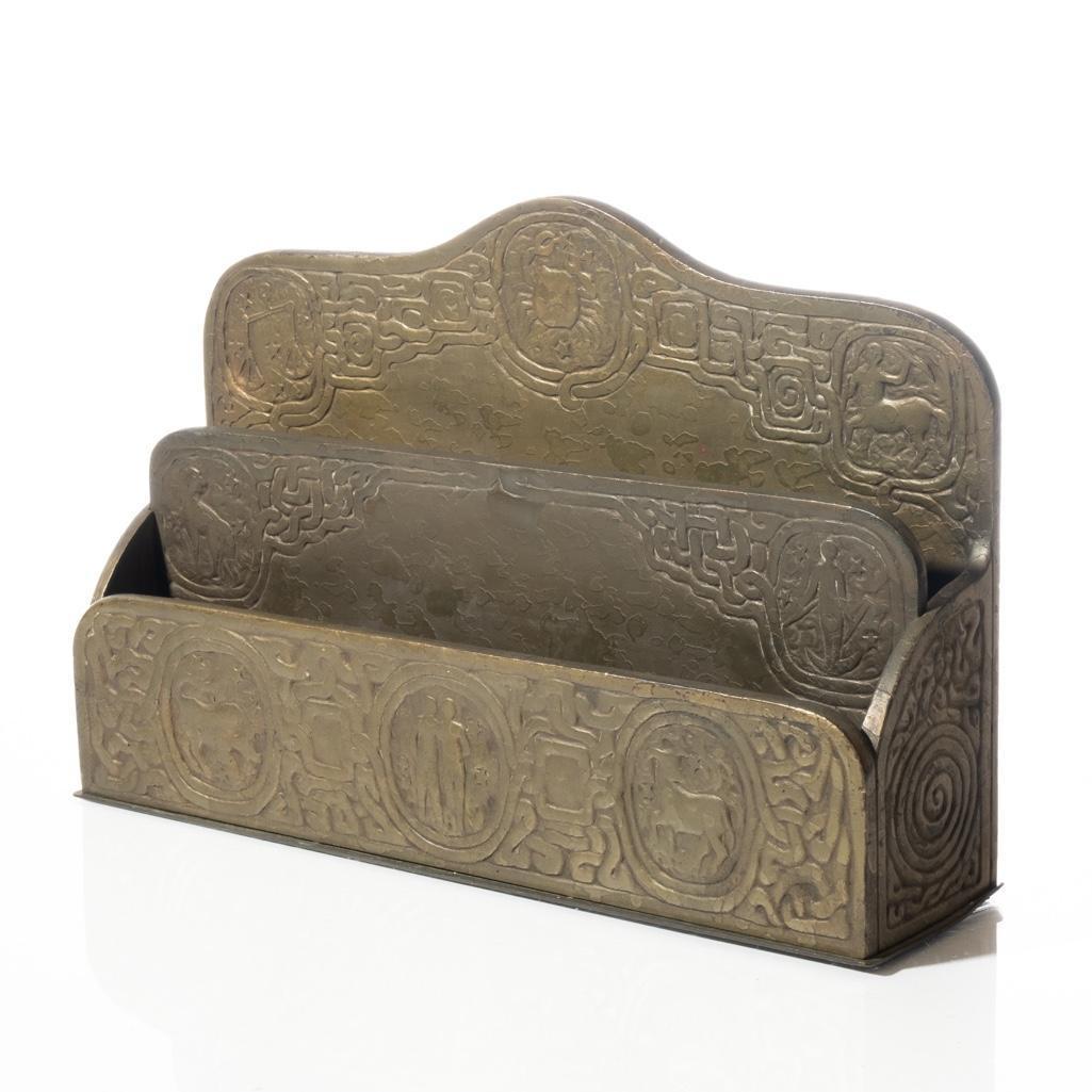 Tiffany Studios, New York. Bronze Letter Rack in the Zodiac Pattern: Early 20th Century Tiffany Studios, New York. Bronze Letter Rack in the Zodiac Pattern Early 20th Century Tiffany Studios, NY. Bronze letter rack/desk accessory in the zodiac pattern. Marked Tiffany S